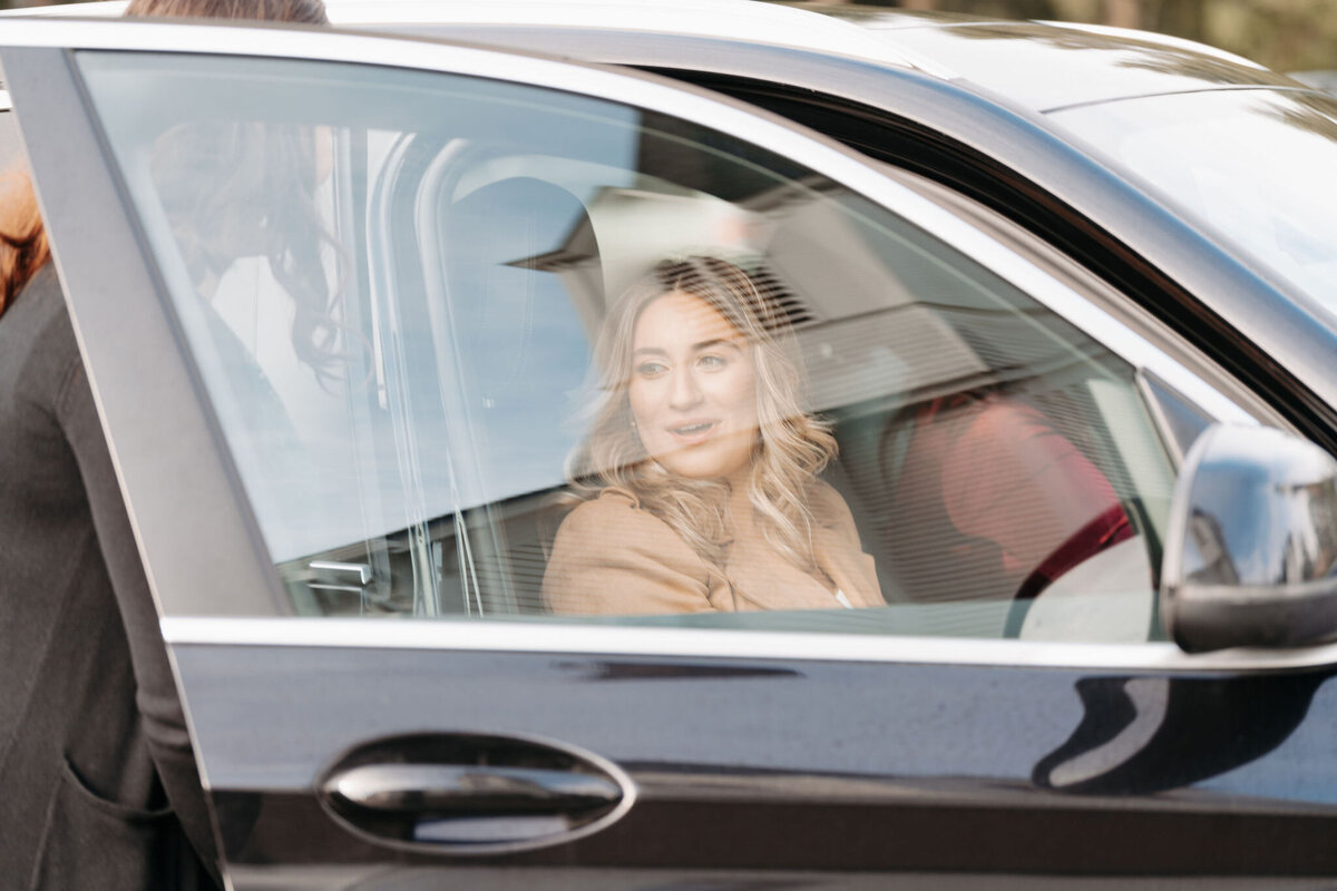 a bride arriving by car on her wedding day