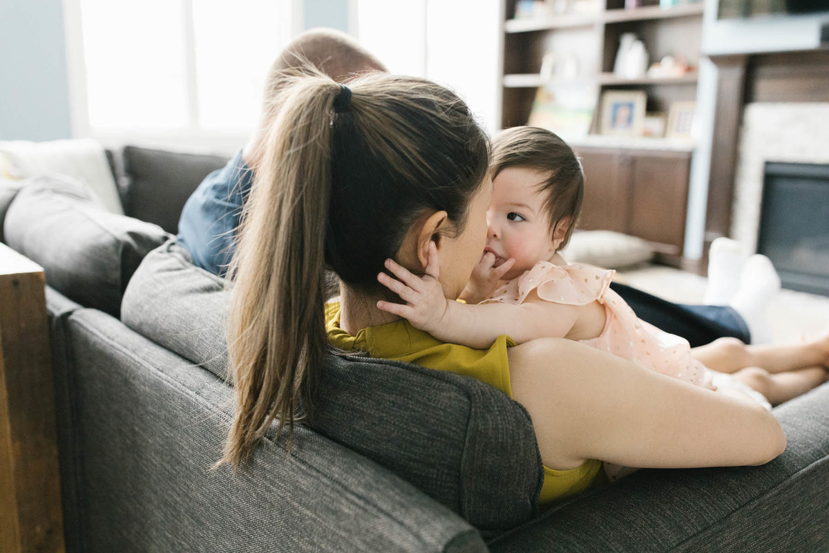 Baby girl looking at her mother during a lifestyle session with Elle Baker Photography