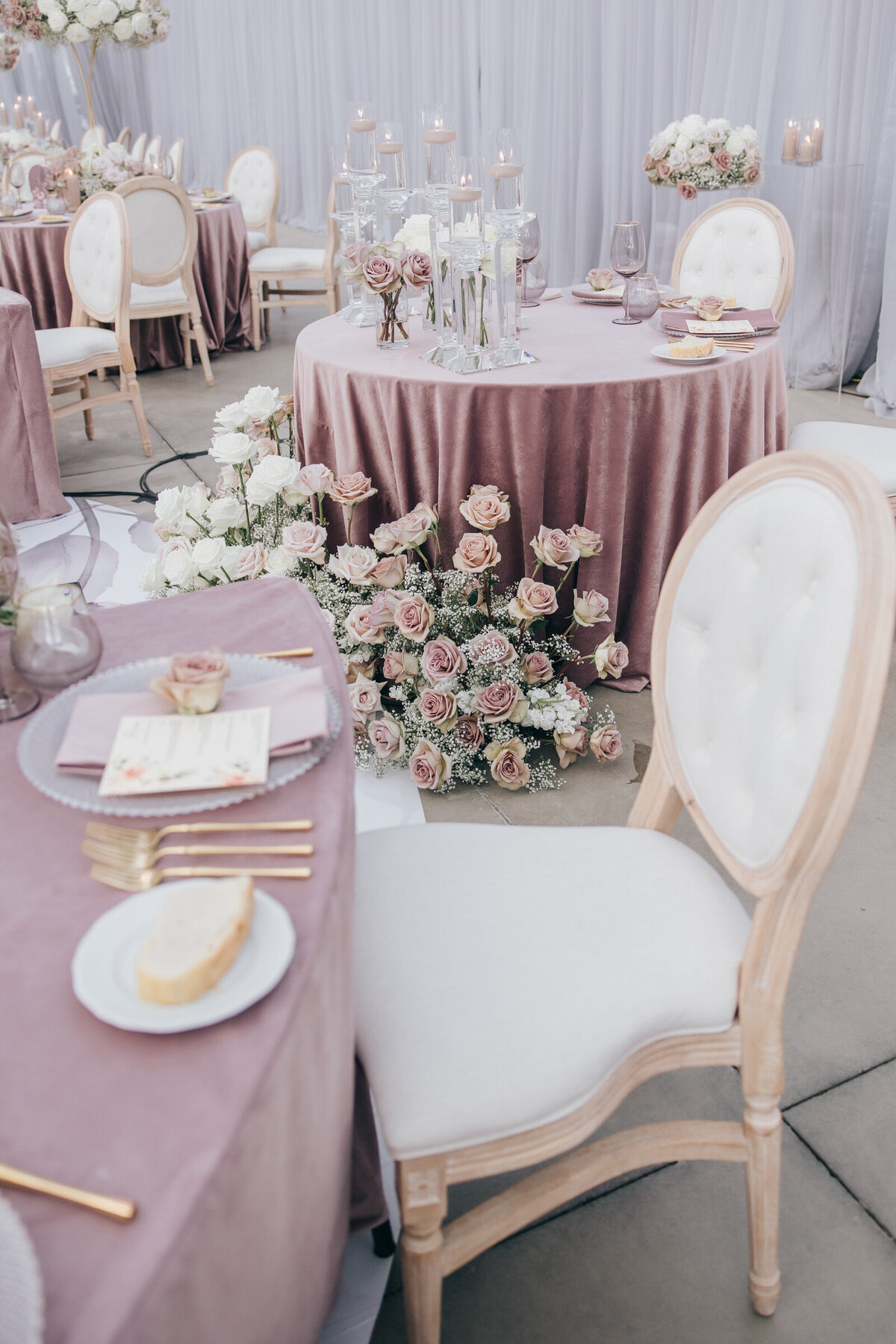 Luxurious wedding dinner with crystal candlesticks and blush roses