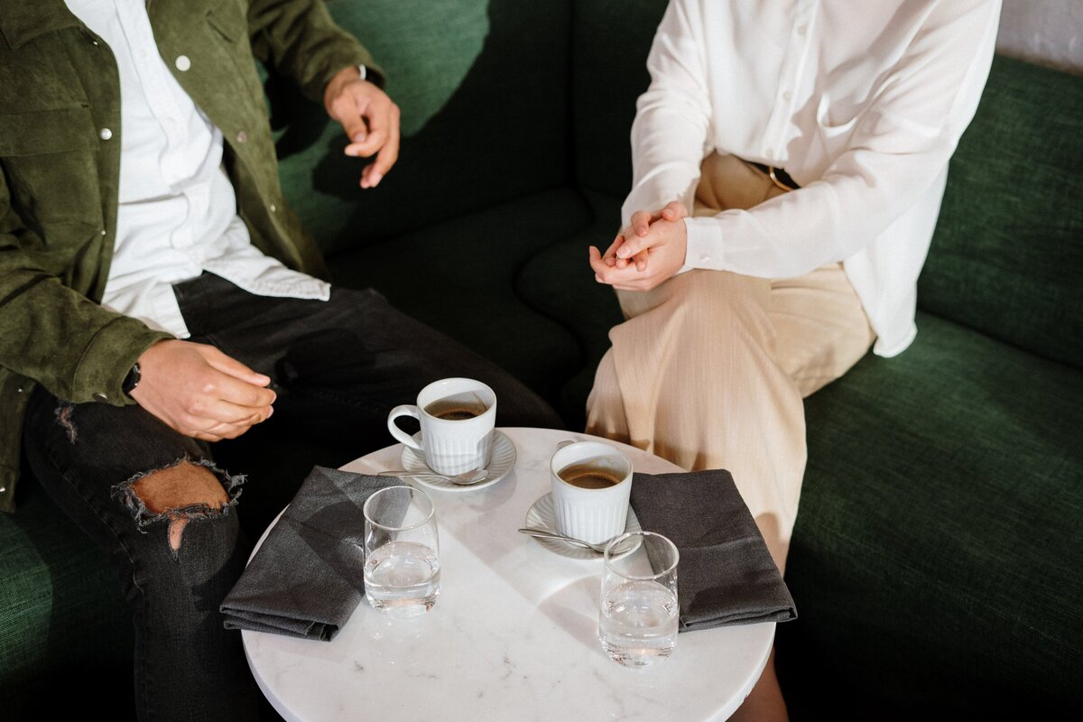 man-in-white-dress-shirt-sitting-on-chair-4255404