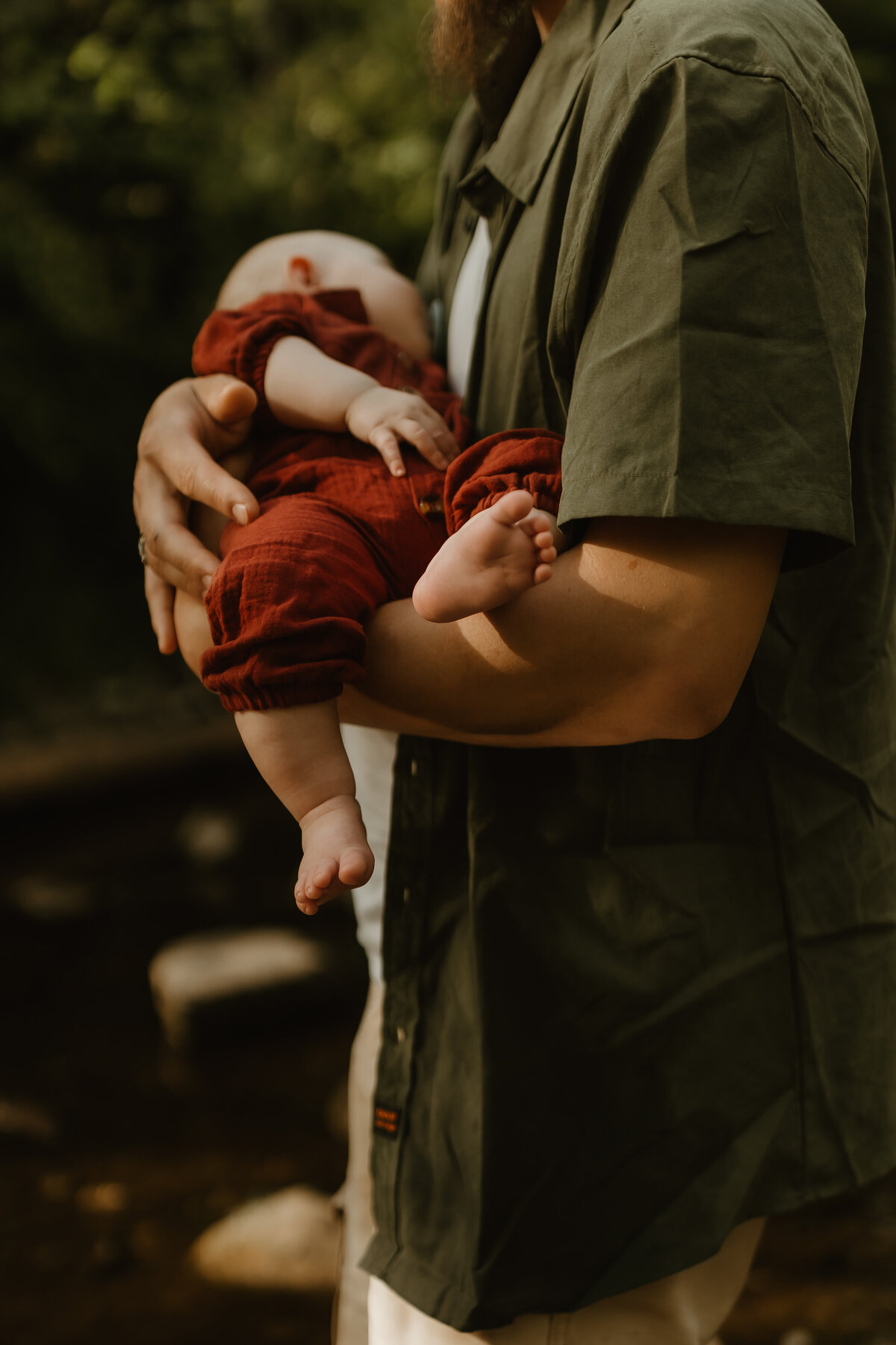 dad holding baby, detail photo of babies toes 