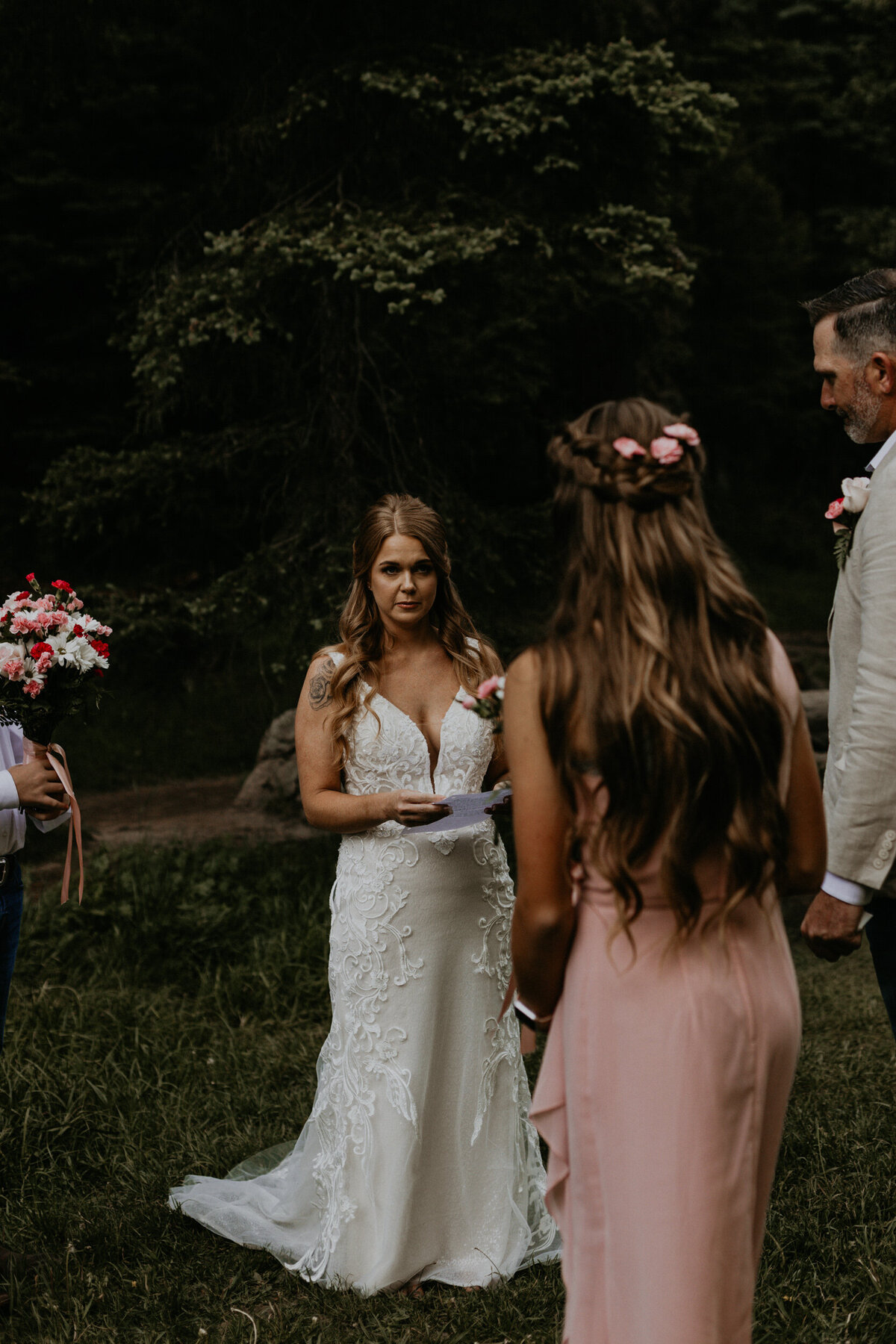 bride reading vows during their wedding ceremony
