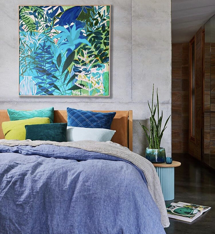 Modern dining nook with rattan pendants and vibrant floral arrangement – styled by Melbourne interior decorator