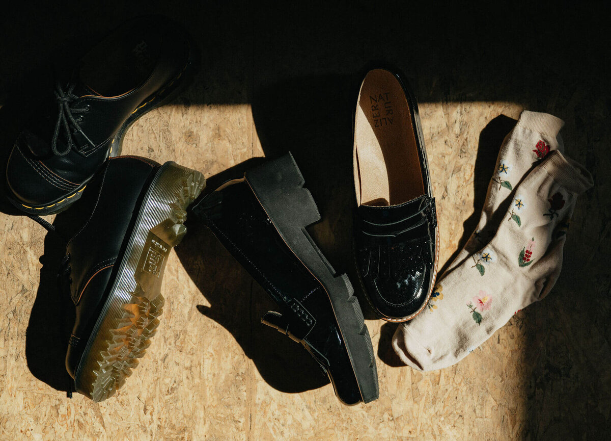 A couple's shoes in the sunlight on their wedding day. 
