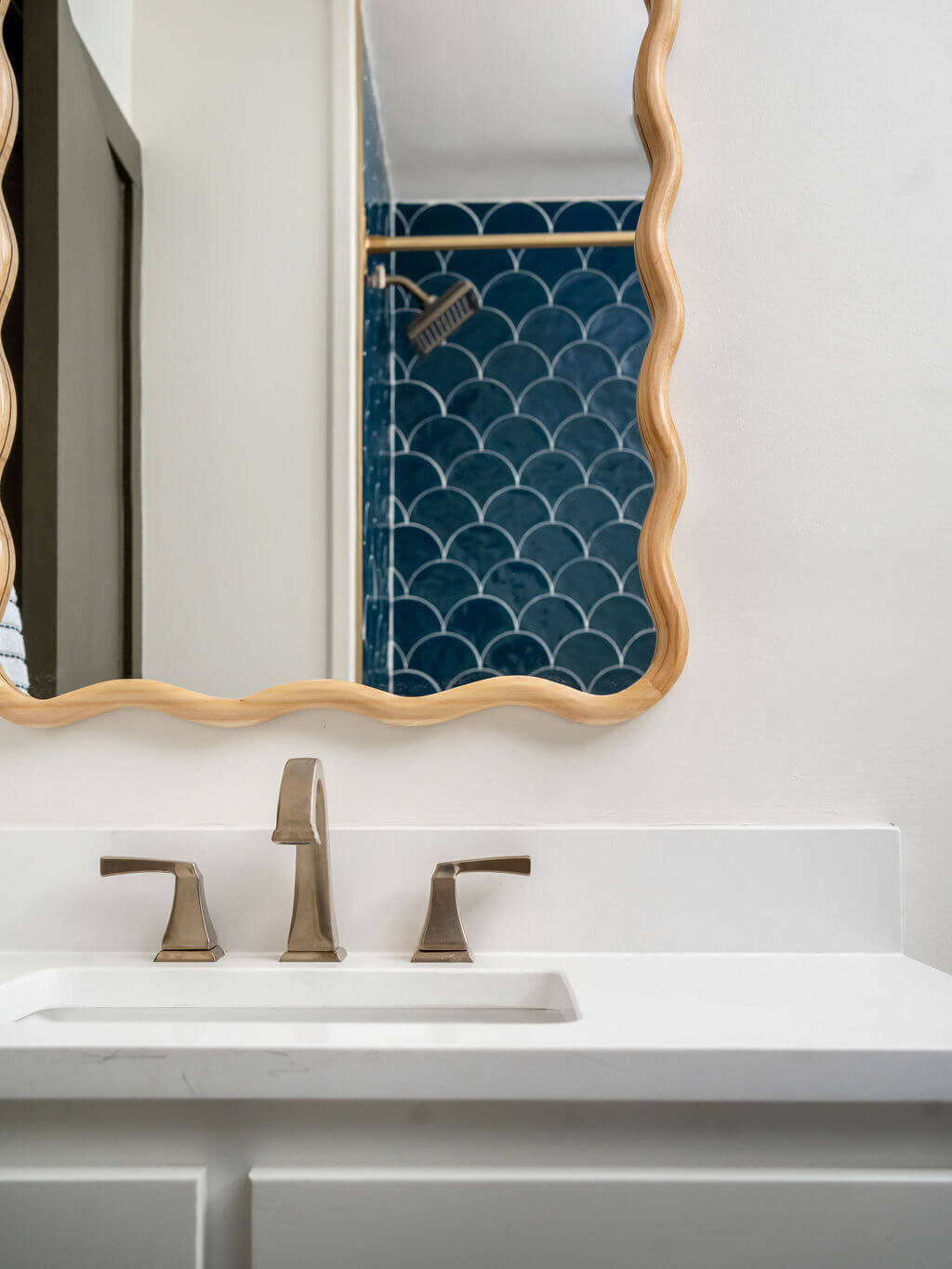 sweet southern home mid mod white vanity with blue tile shower