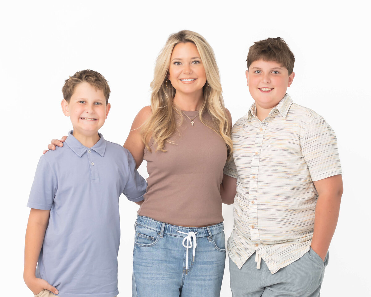boy mom in studio portrait dressed in casual neutrals