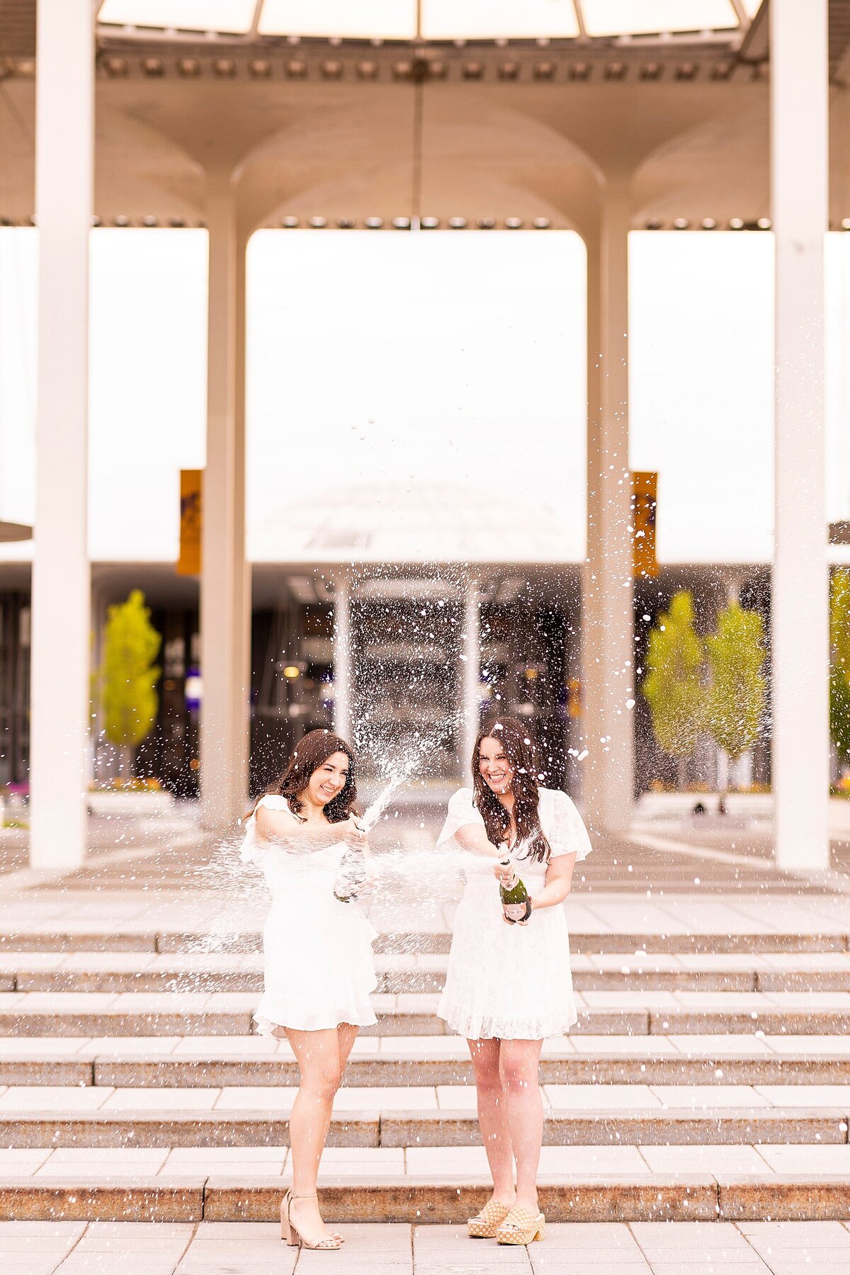 Graduates in downtown Charleston photographed for personality-driven, luxury-style portrait session