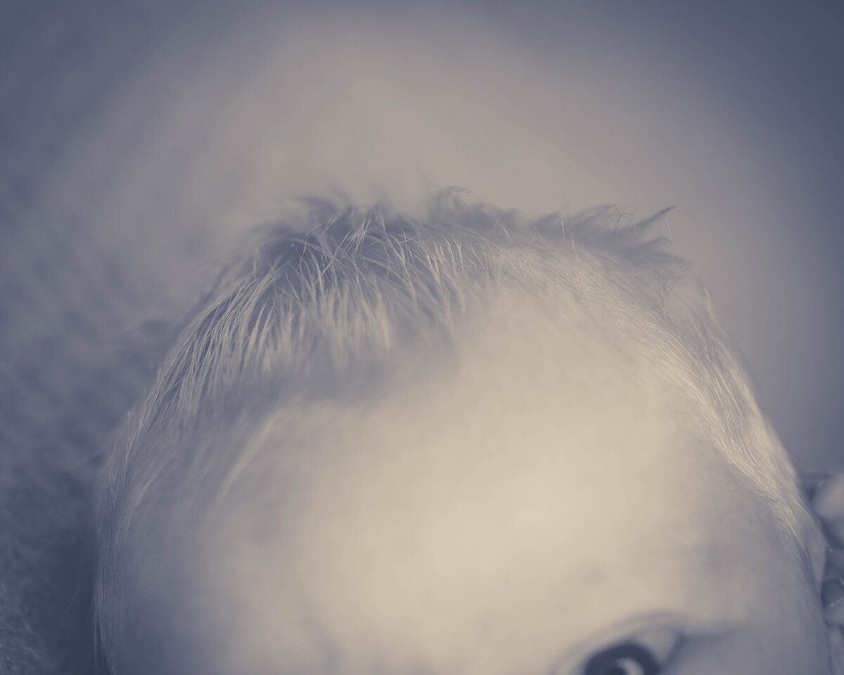 Details of a newborn baby's hair in black and white