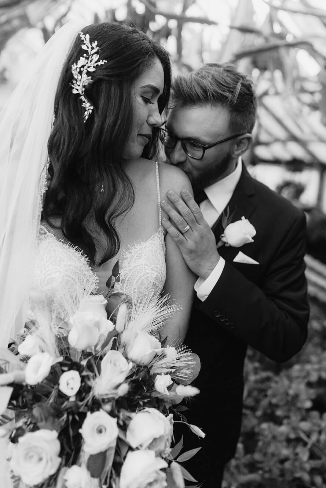 Groom kissing brides shoulder at Finger Lakes wedding, NY