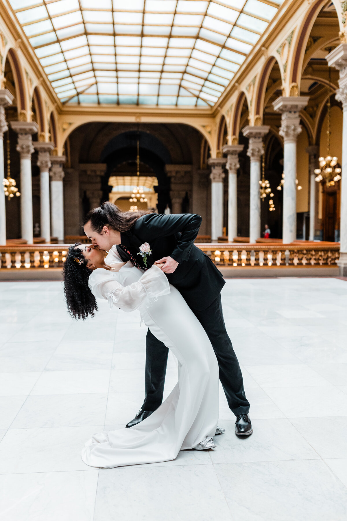 Bride and groom dancing in a beautifully lit South Bend wedding venue.