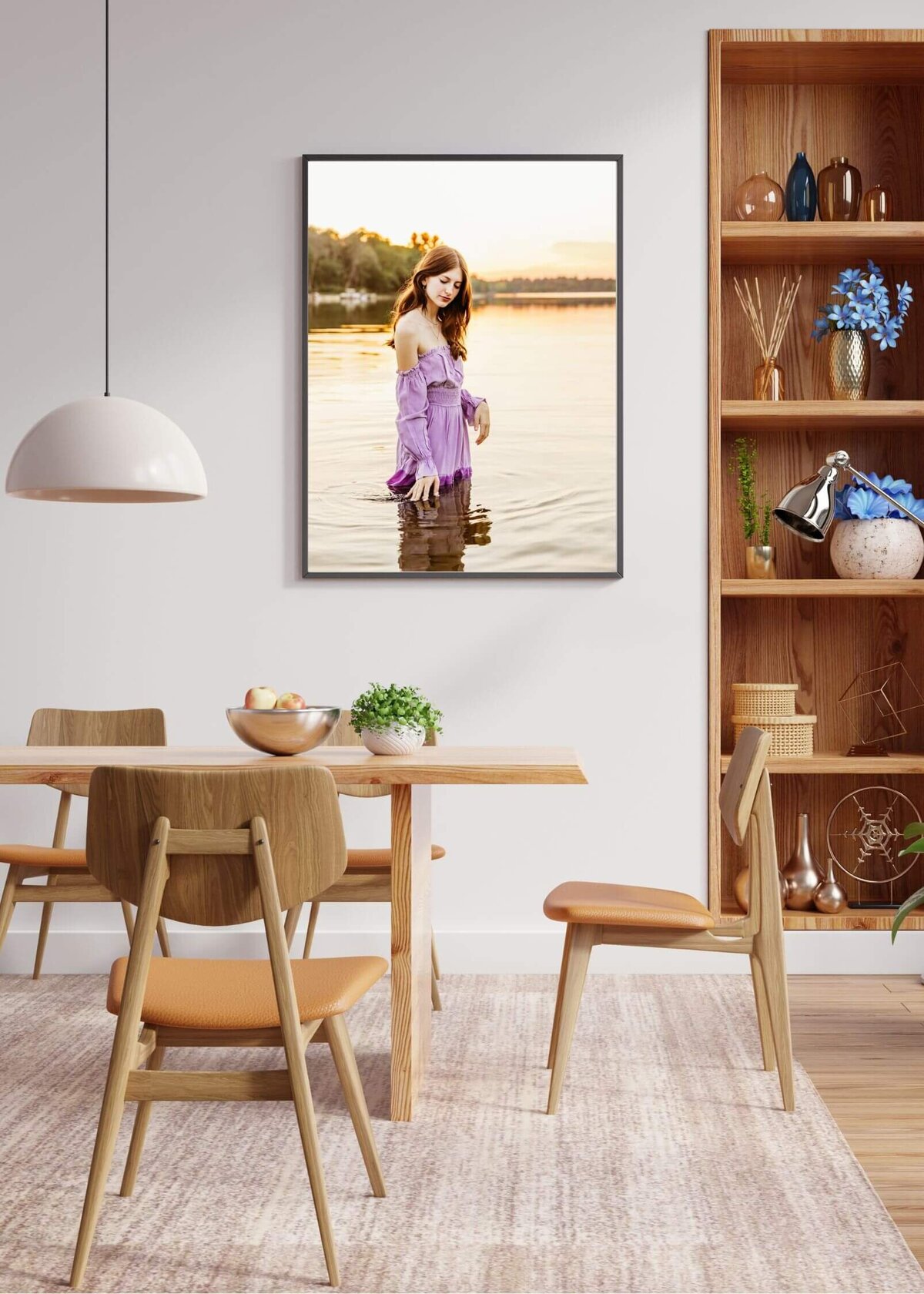 beautifully decorated dining area featuring a senior photo, bookcase and dining table