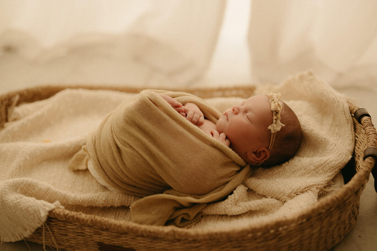 Nashville newborn photographer captures candid family snuggles in studio