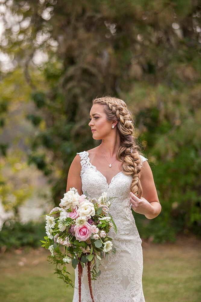 Country bride with long braid and Spring florals