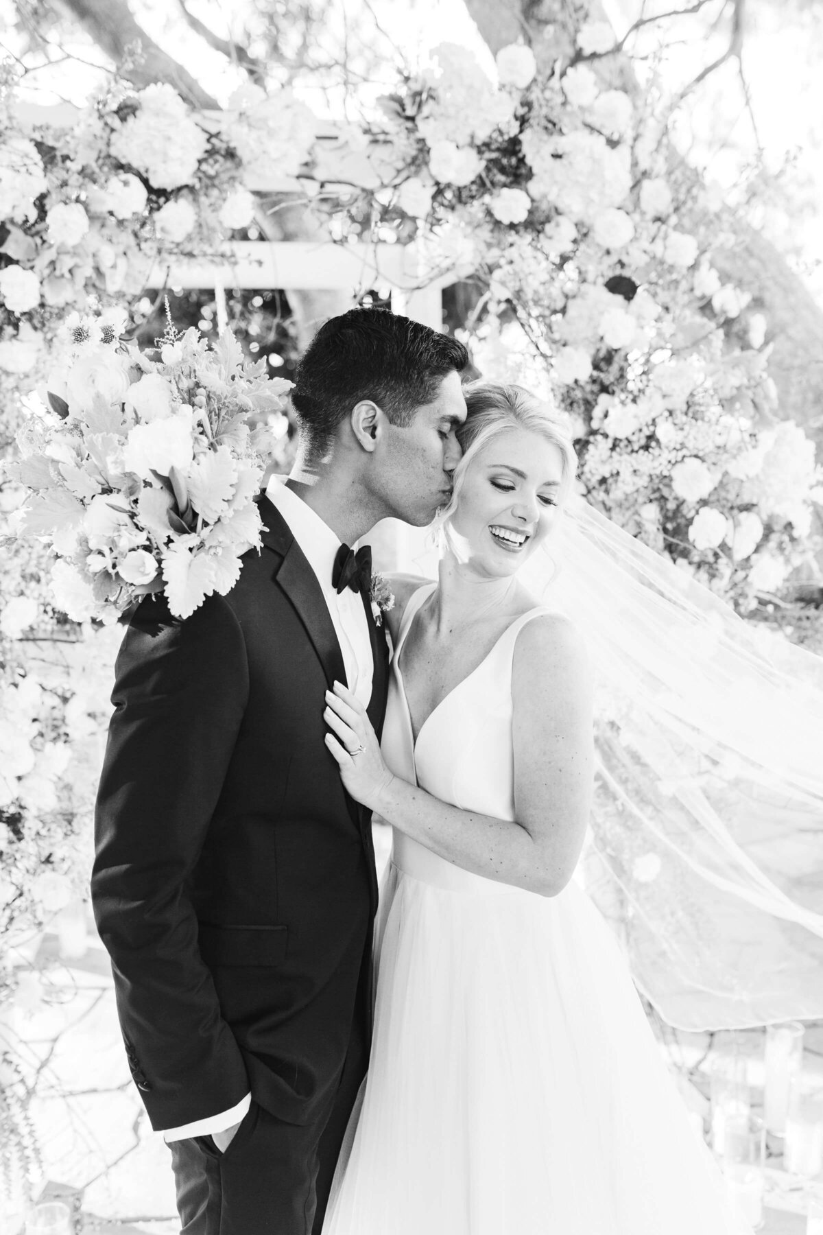 bride and groom smiling