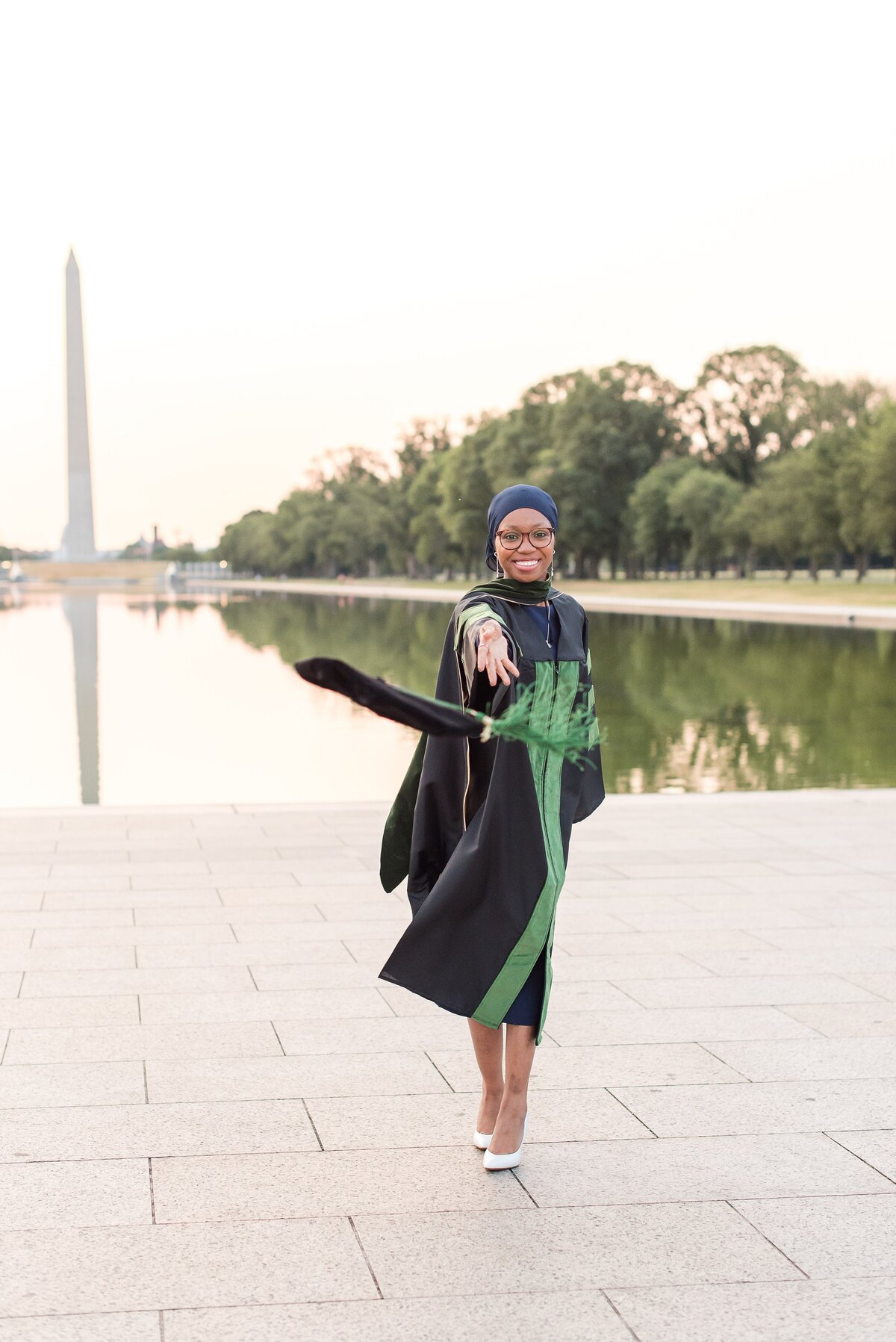 med school graduae at reflecting pool