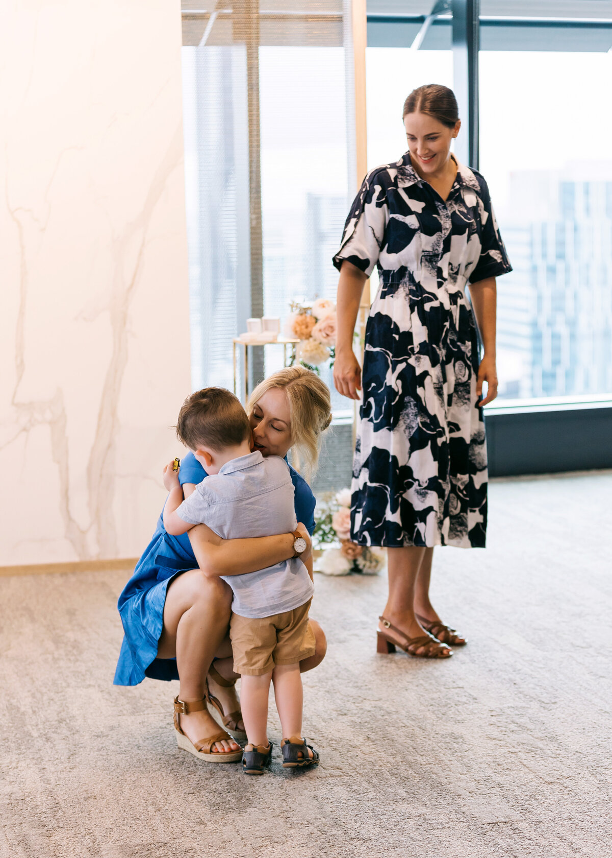 Bride and bride with their son at the Brisbane Registry Office after getting married 