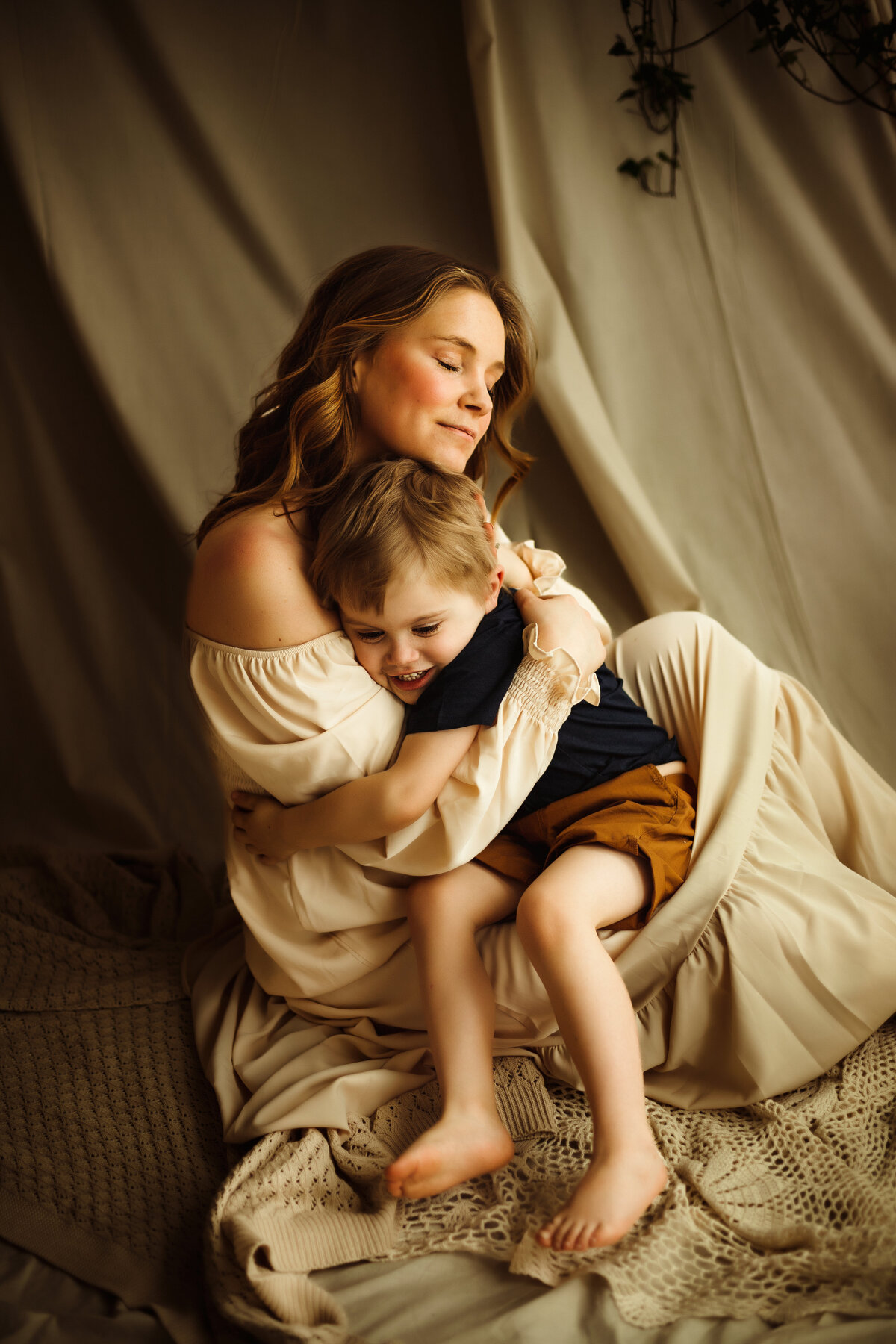 mother and son embracing at motherhood photography photoshoot