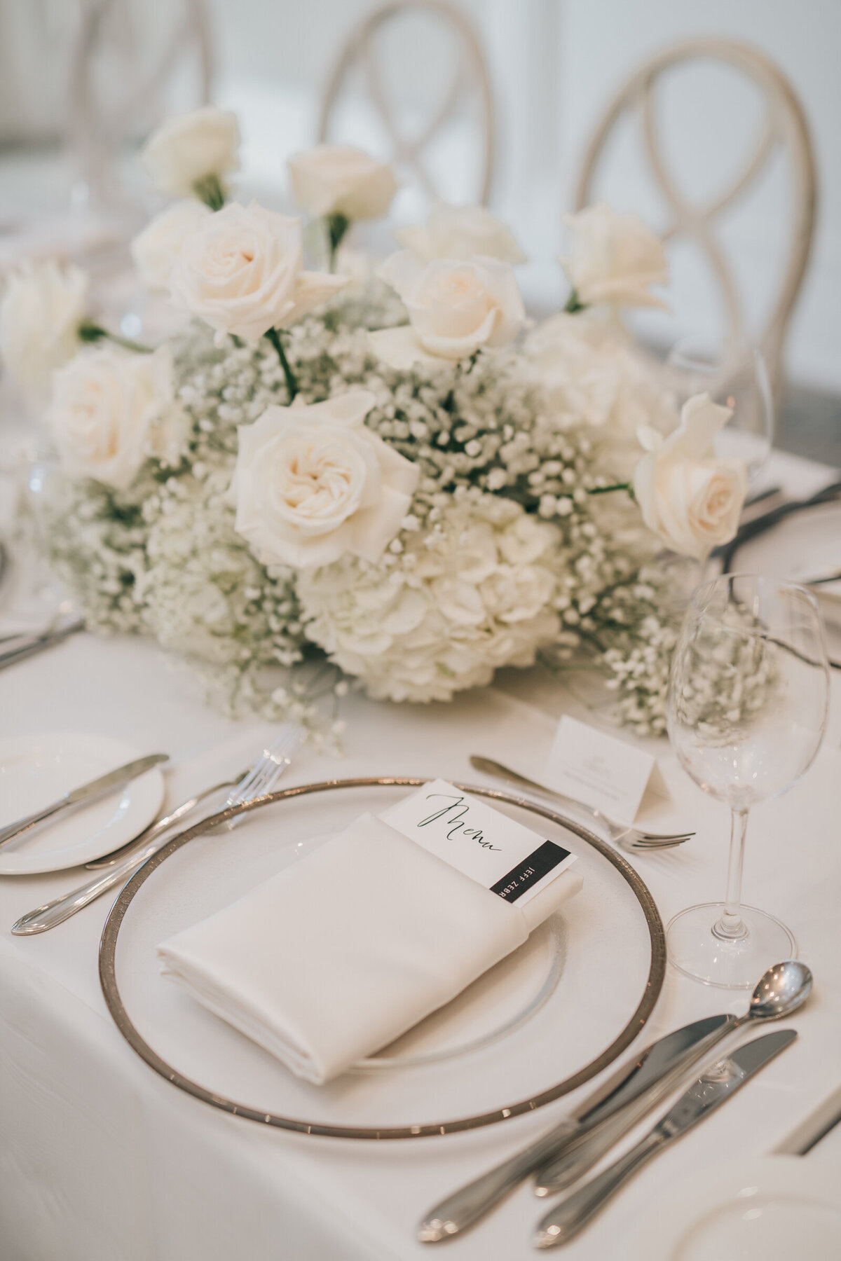 Gorgeous white wedding reception decor, florals and table settings