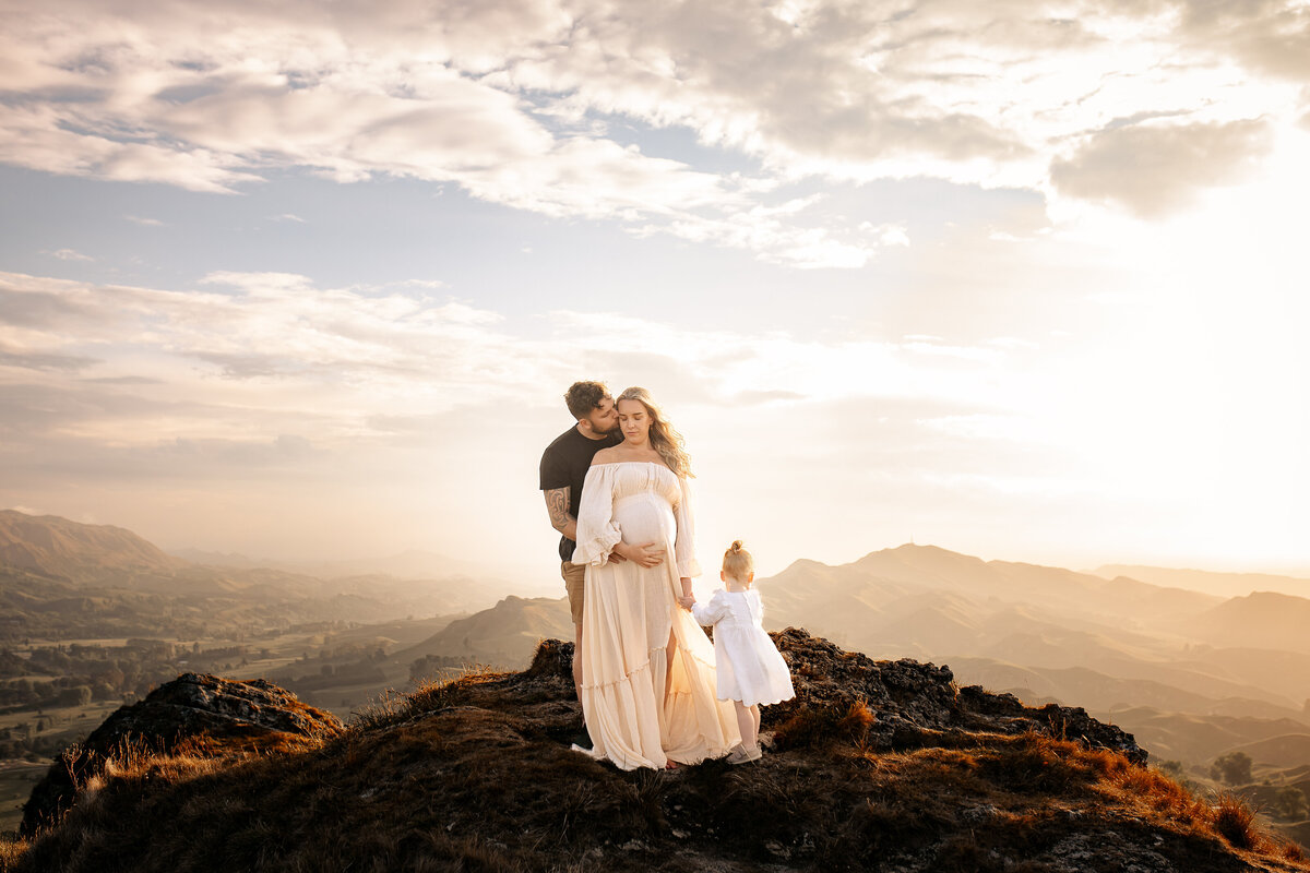 Hawke’s Bay family photographer specialising in maternity, newborn, and family portraits — mountain location session with expecting mother and family captured by Lightkeeper Photography, Napier and Hastings.