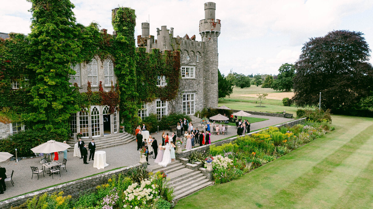 A wedding aerial drone photo of guests during cocktail hour at Luttrellstown Castle