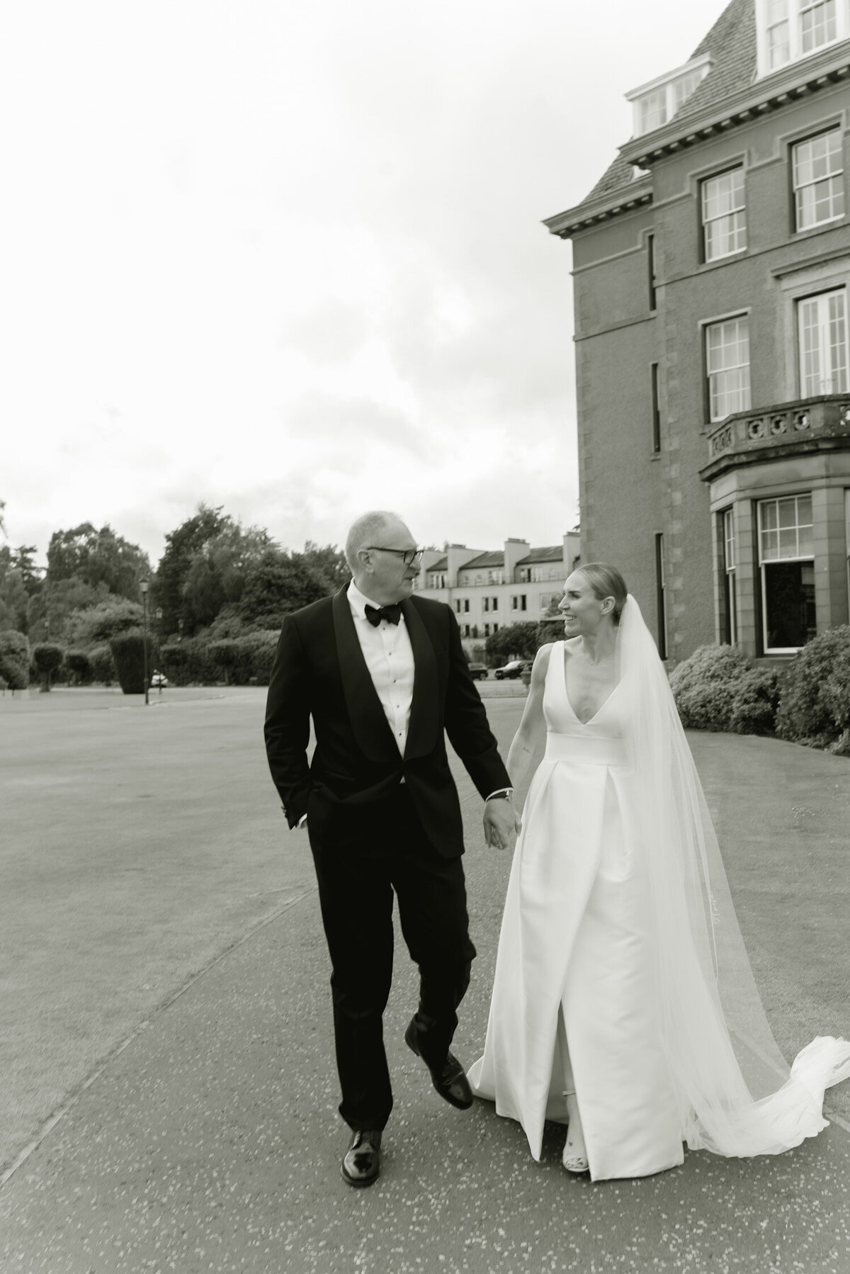 Editorial wedding photography of Bride and Groom in the grounds of Gleneagles Hotel. Wedding flowers by Wild Burnett at Gleneagles on an intimate black tie wedding day. Image by luxury wedding photographer Scotland, Jill Cherry Porter.