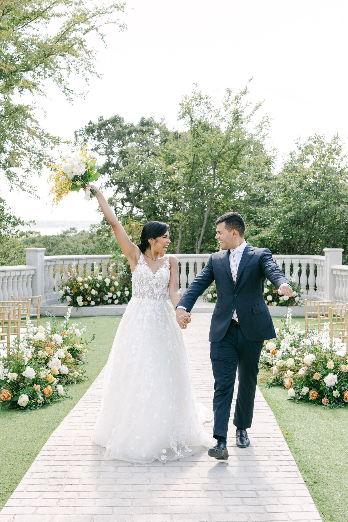 a bride and groom celebrating on their wedding day