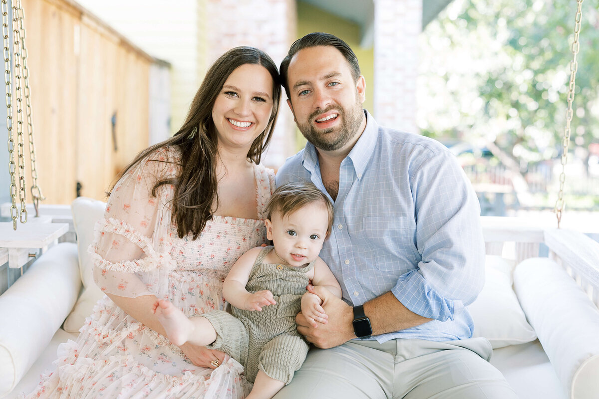 parents sitting with their baby
