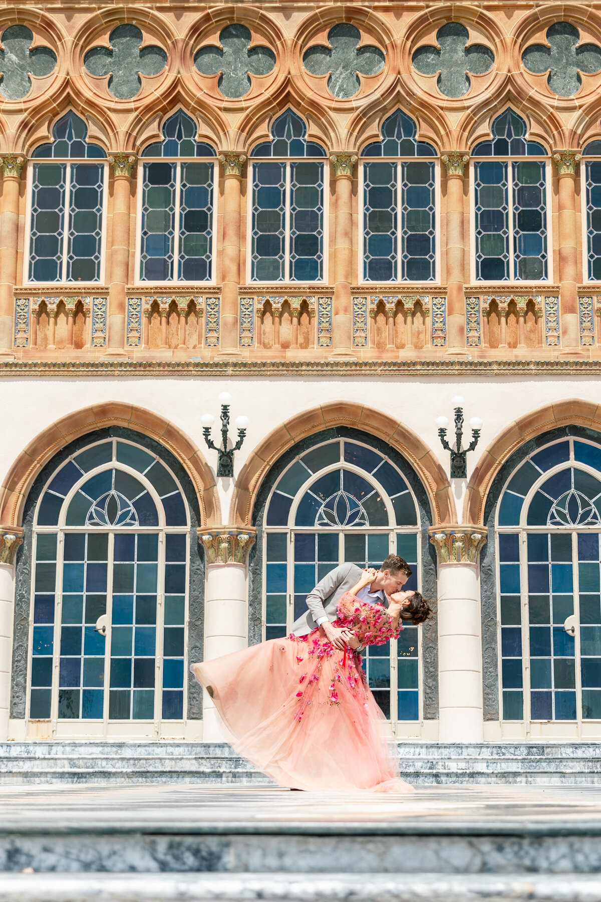 photo of man dipping girl by wedding photographer in sarasota fl