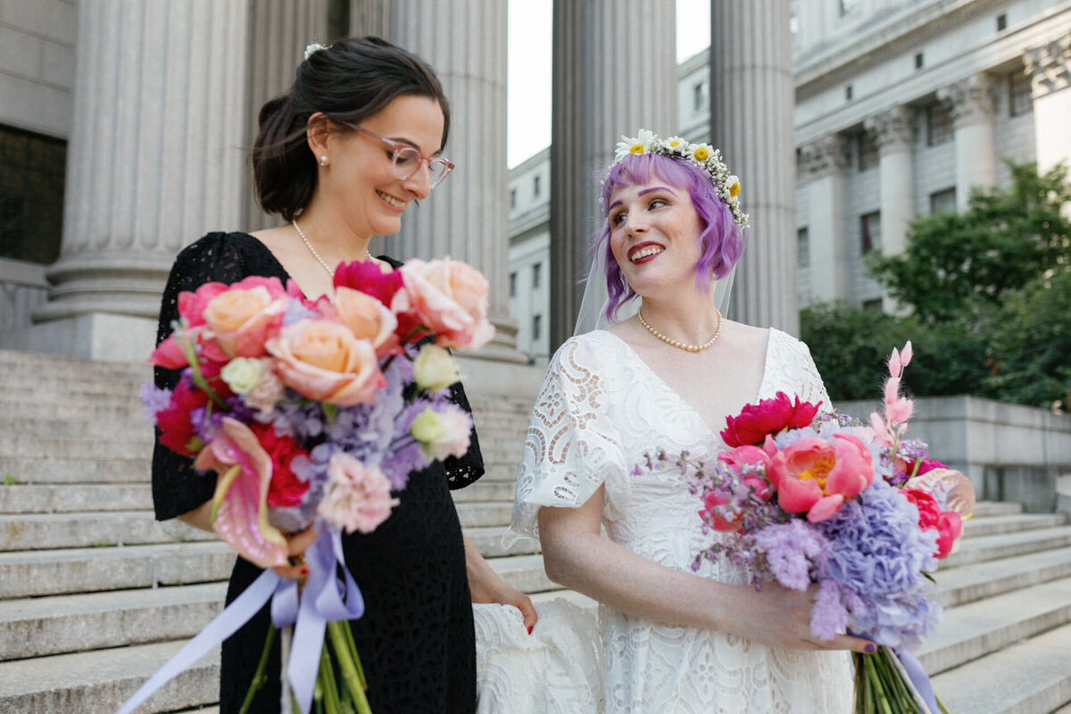 manhattan city hall couple one bride with purple hair on courthouse steps with pastel bouquets by dearest rachel nyc
