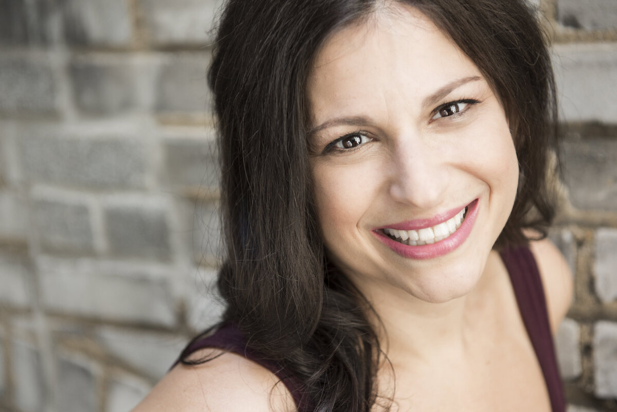 A woman smiling big