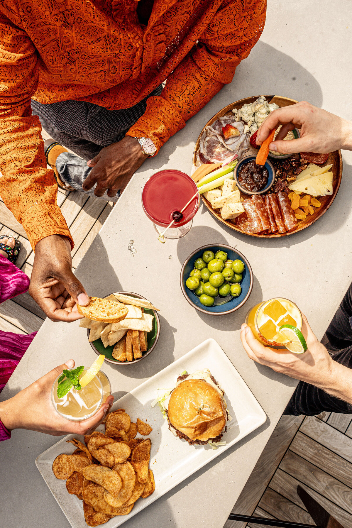 Food Photography in Asheville, NC featuring people grabbing food in a flat lay