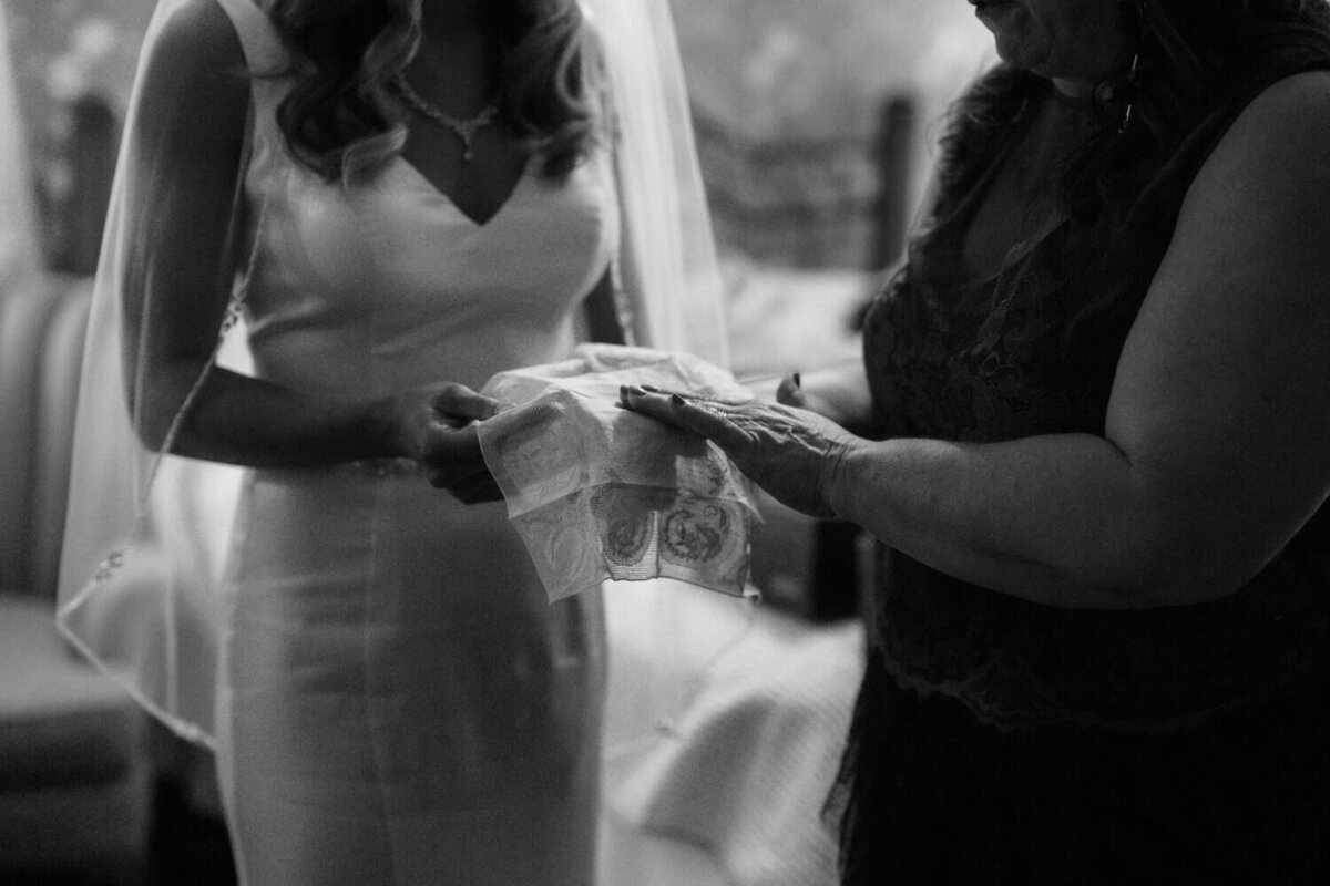 mother-showing-bride-embroidered-handkerchief