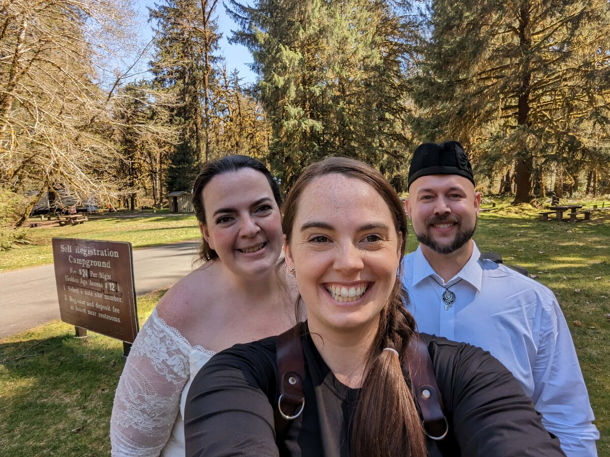 copule taking picture with Sage Trails after Washington Elopement