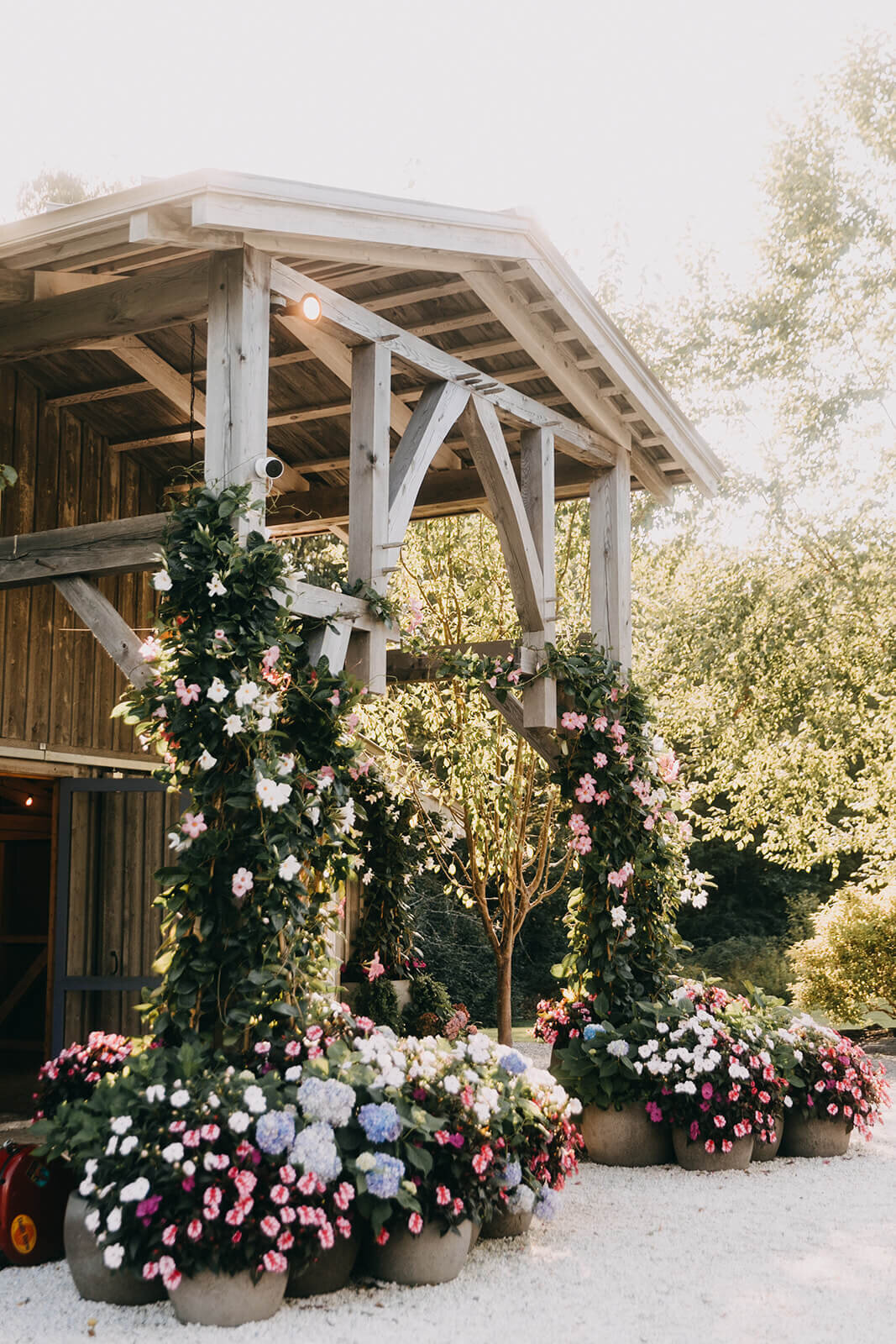 34wedding-barn-entrance-floral-decor-pink-white-green