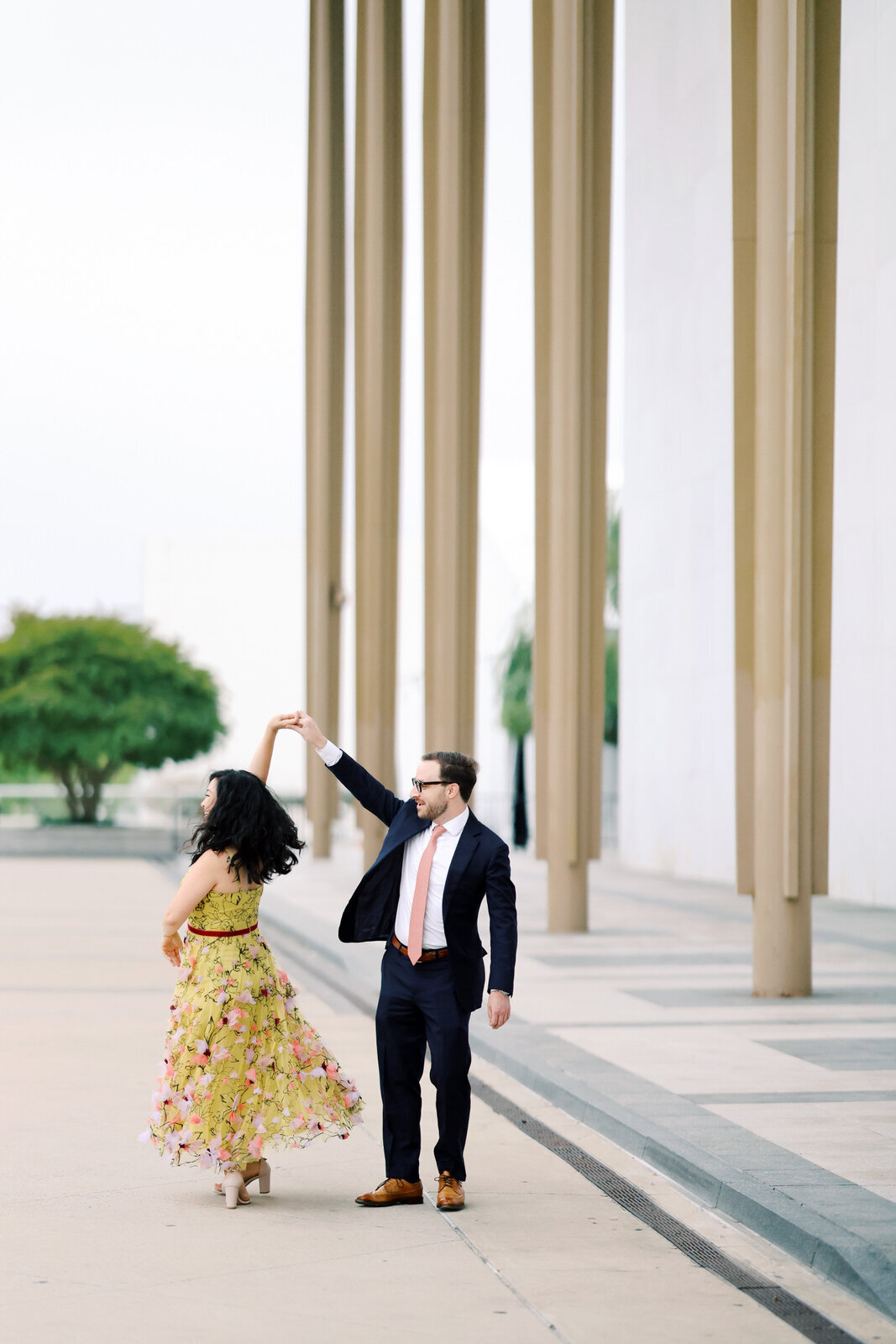 DC film wedding photographer photographs a stylish couple during their Kennedy Center engagement session.