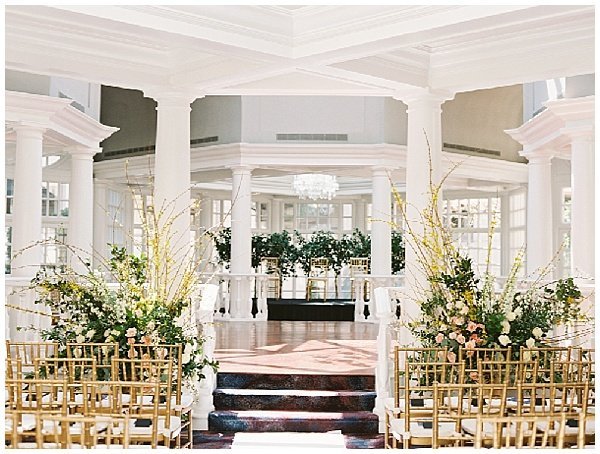 Wedding Ceremony in the Colonnade Washington DC Gold Chiavari Chairs © Bonnie Sen Photography
