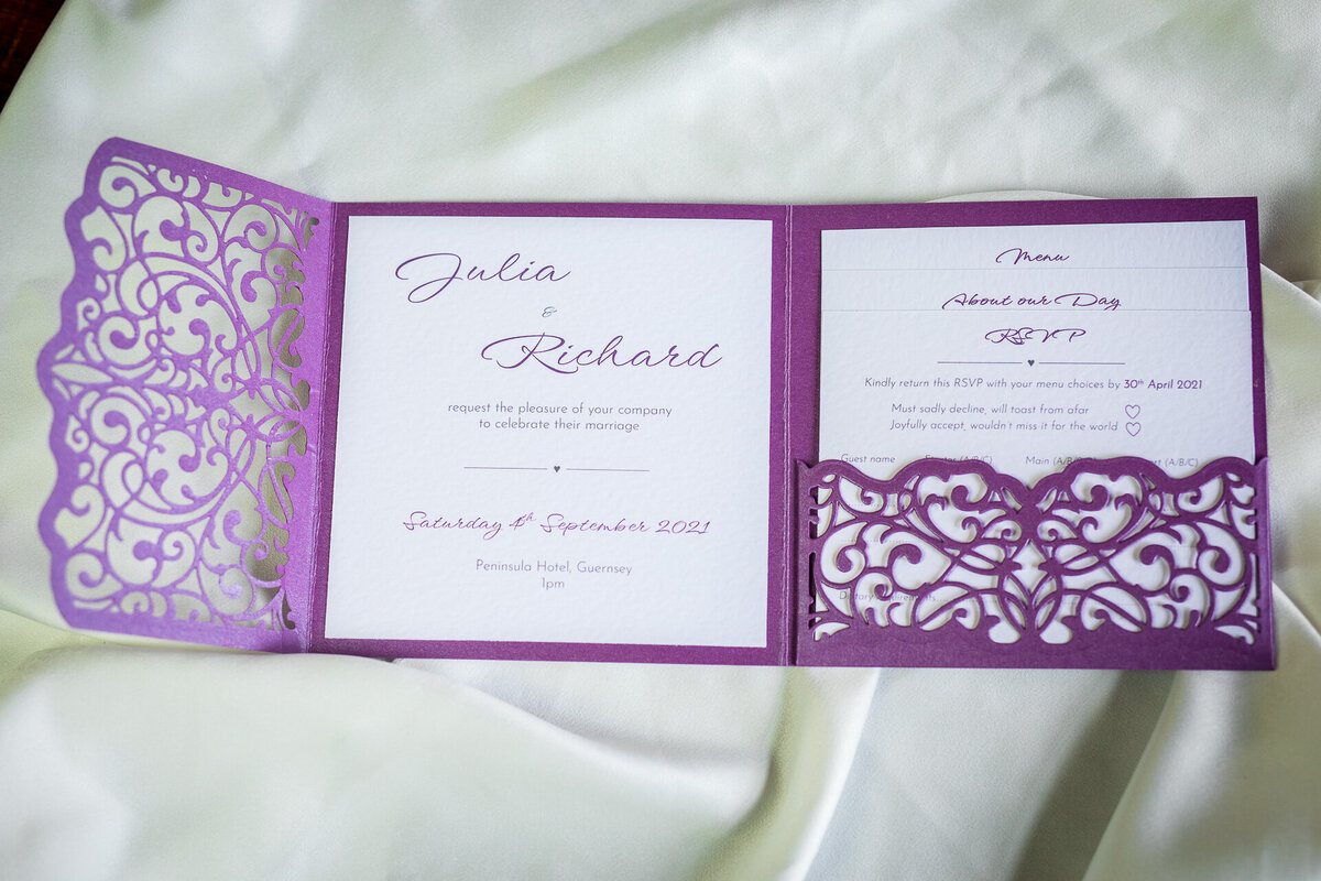 Lacy wedding invitations in purple