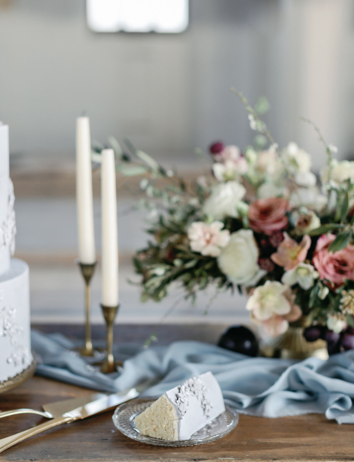 sliced wedding cake, table with candles, flowers, Greece destination wedding photographer