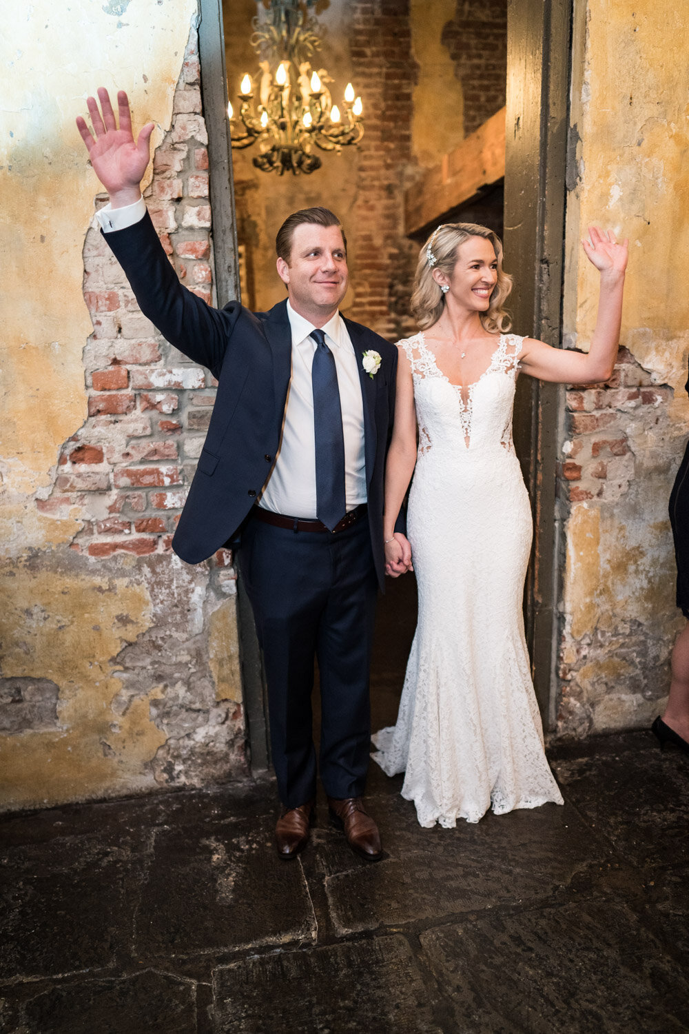 Bride and groom entering reception