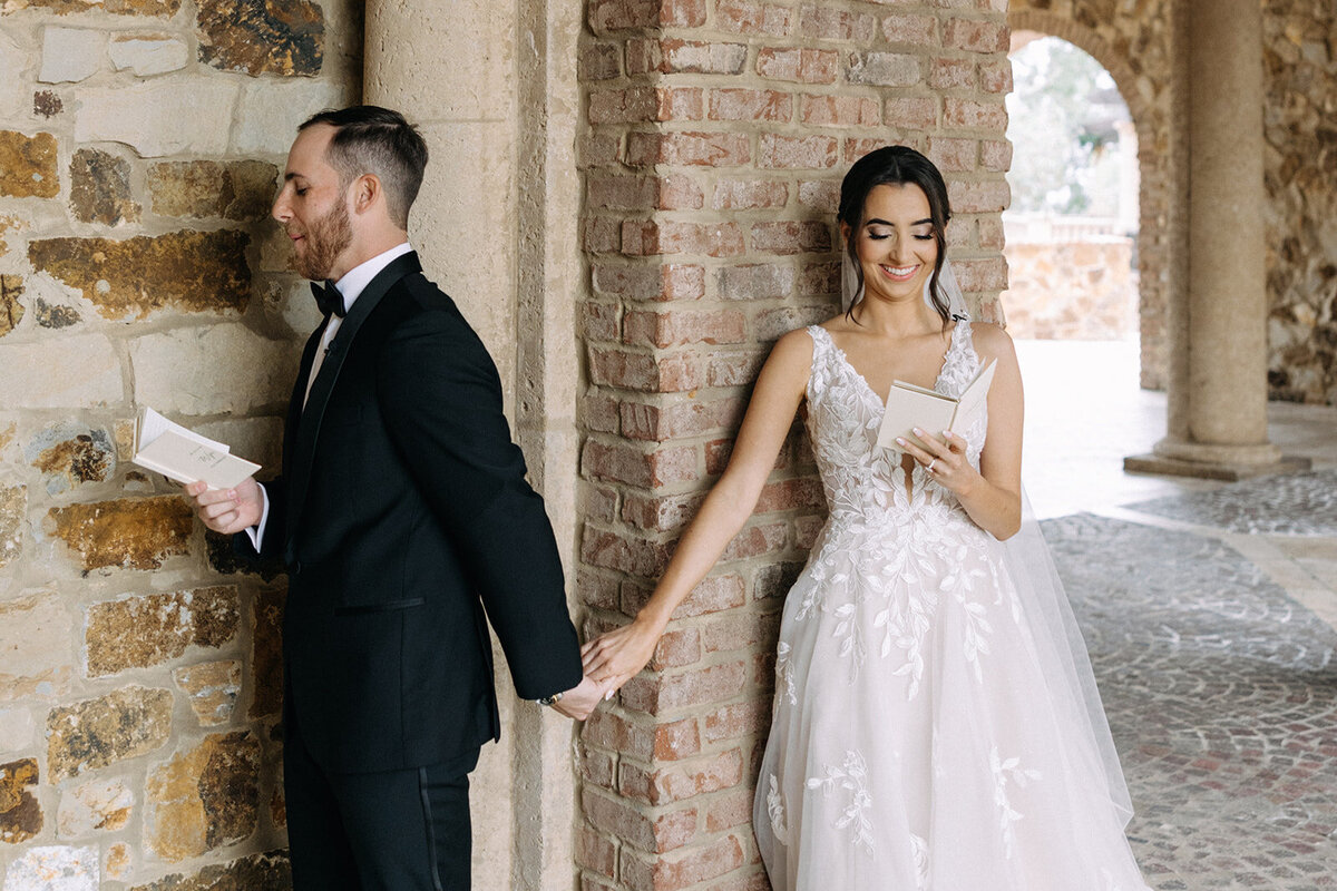 bride and groom first touch at bella collina wedding photos​