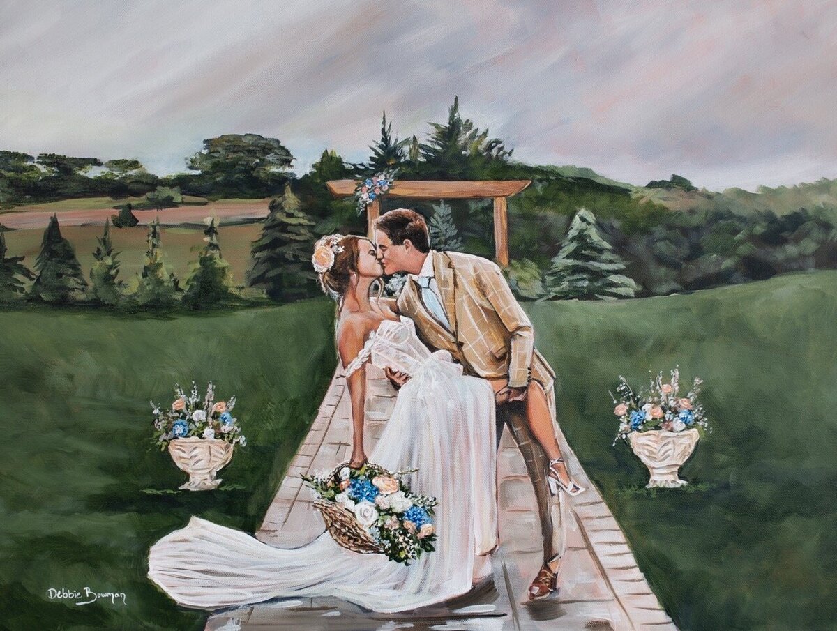 First kiss with the groom dipping the bride for a live wedding painting in Emerald Pines SD