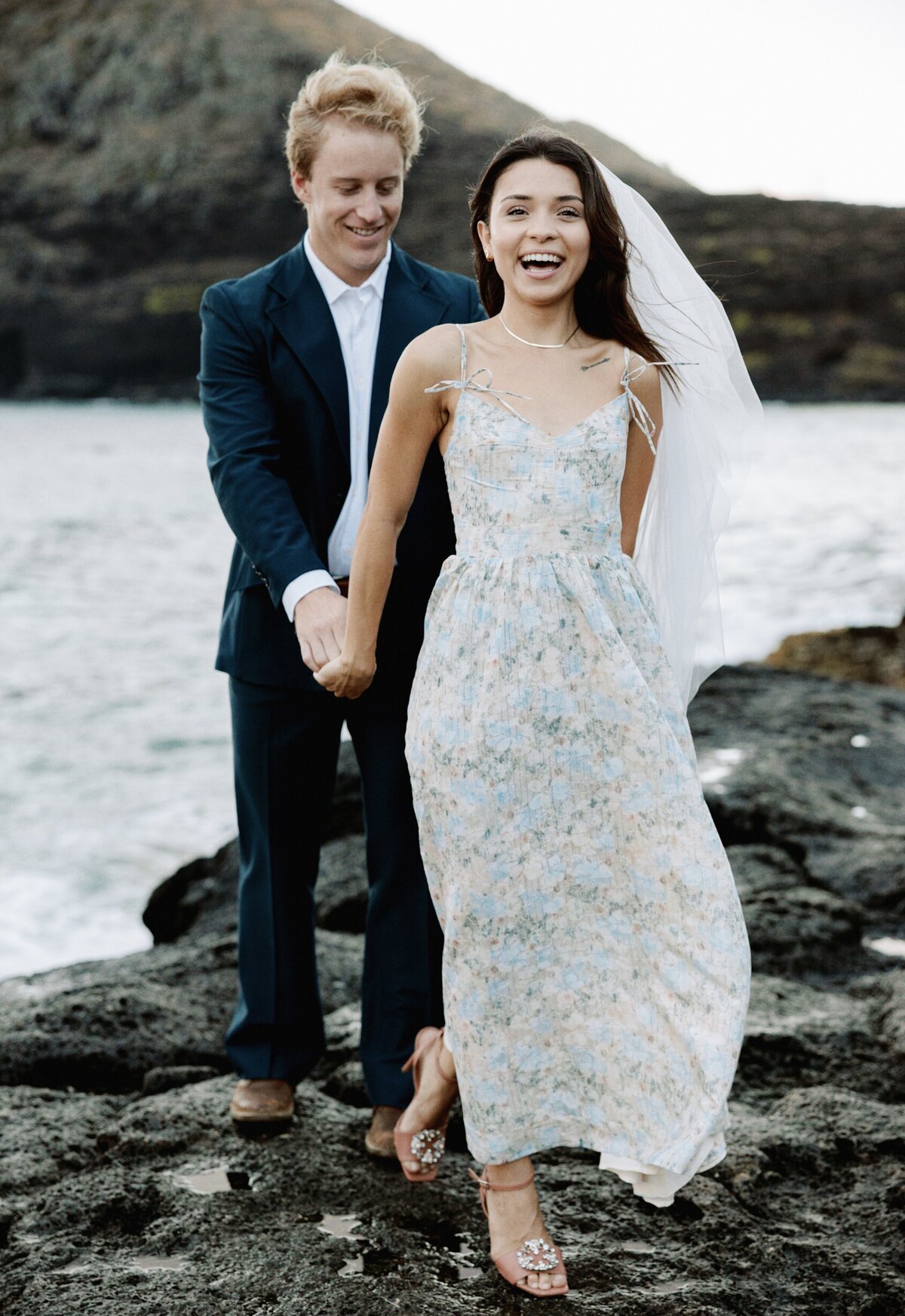 Happy couple laughing during their engagement photoshoot in Carmel, California, captured on film — by Kate Winters Photography.