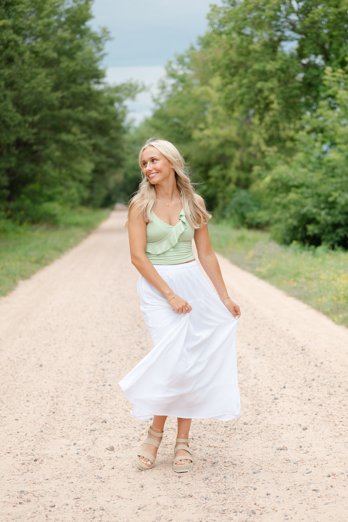 beautiful-girl-twirling-dress-near-treeline