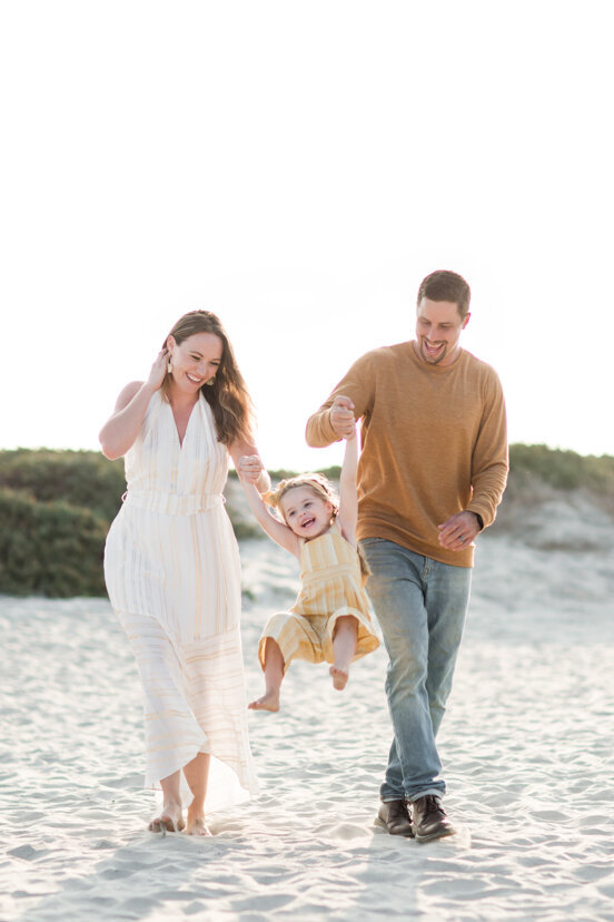 family-walking-on-Coronado-beach-san-diego