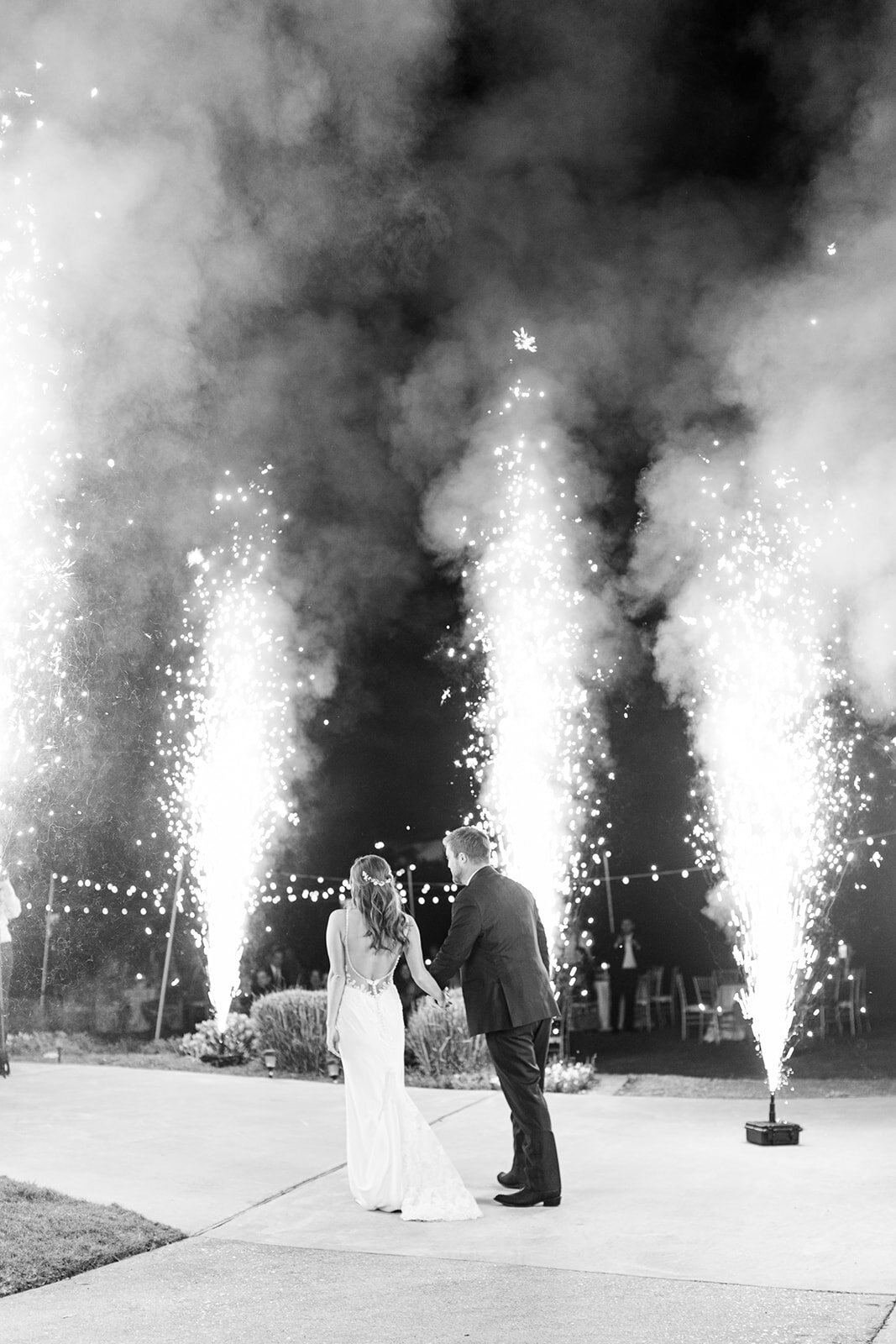 bride and groom enter reception with fireworks