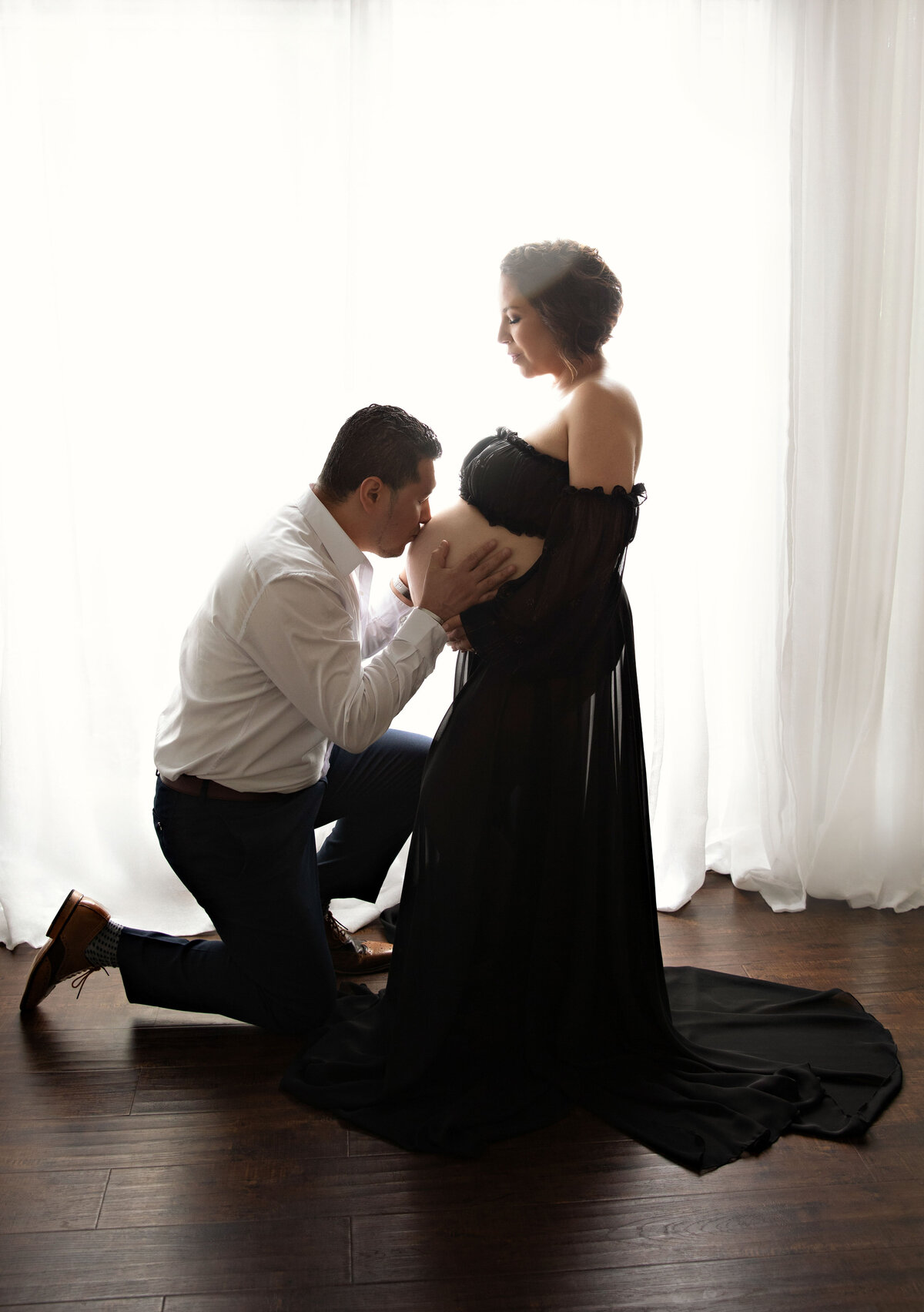 dad kissing belly couple image by best san antonio texas photographers gown maternity photography session 