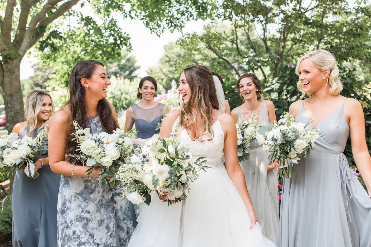 bride and her bridesmaids laughing