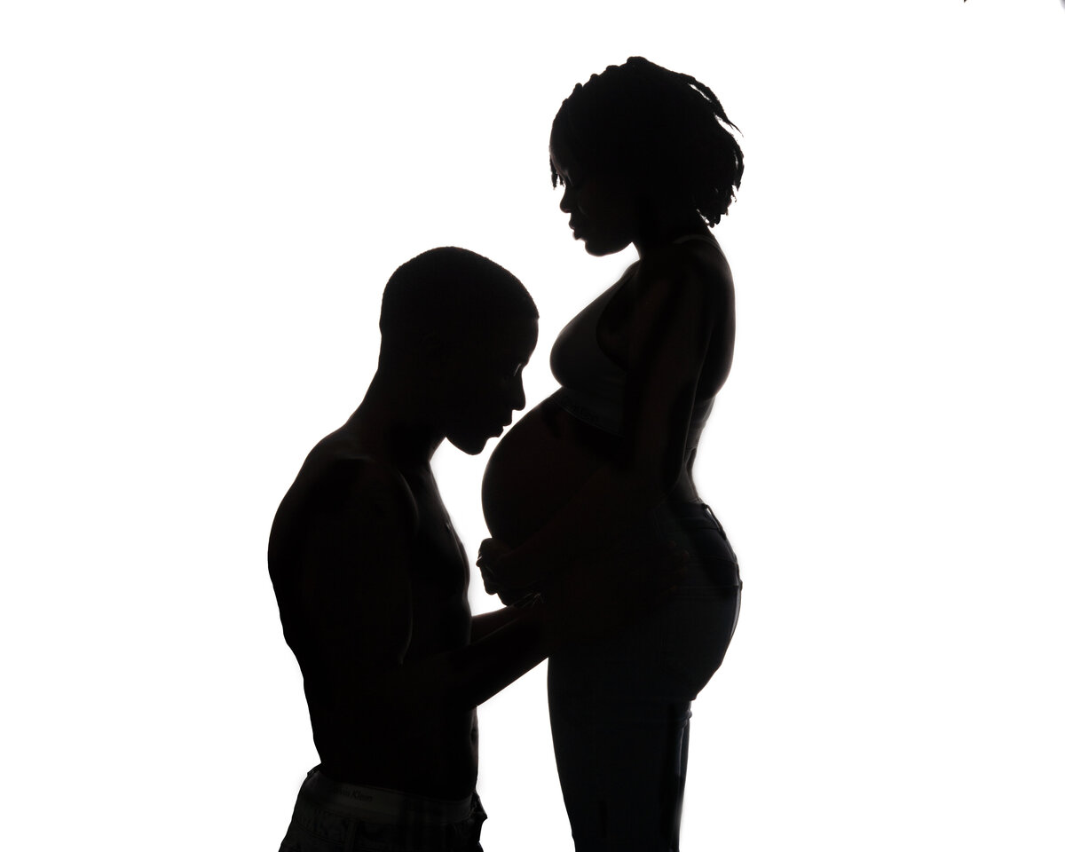 maternity belly silhouette black white studio couple