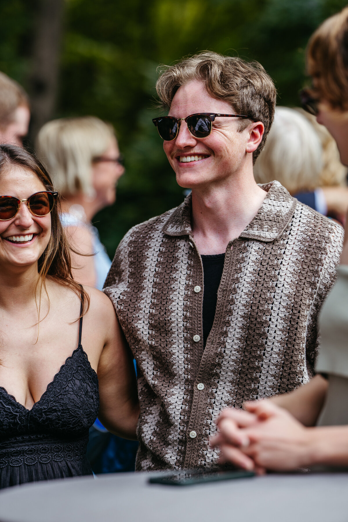 Wedding guests smiling and talking during celebration