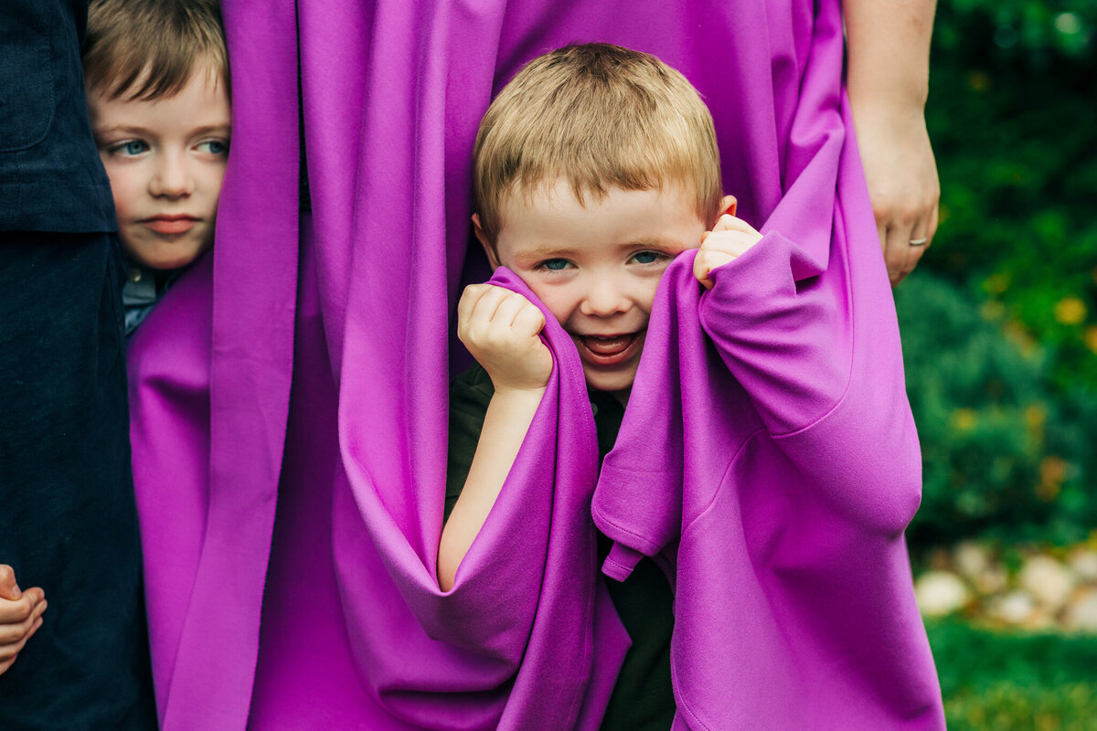 boy-hiding-in-moms-skirt